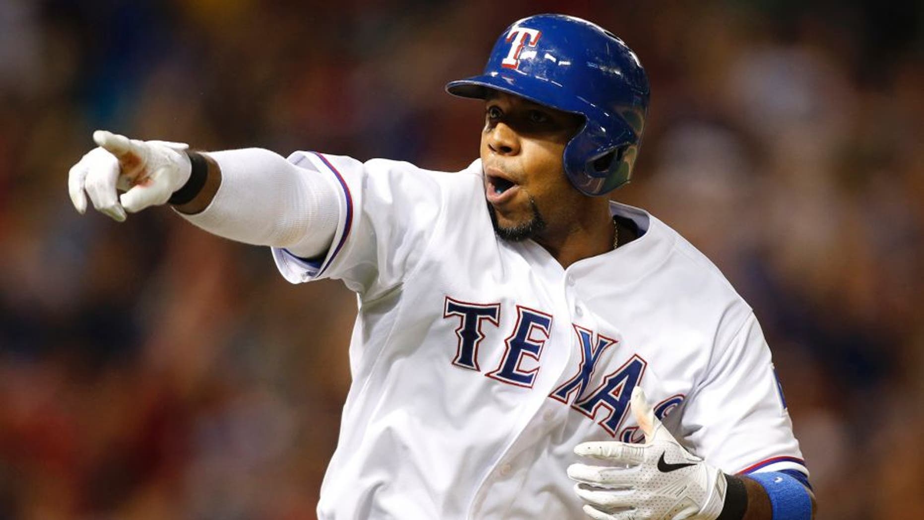 Jun 12, 2015; Arlington, TX, USA; Texas Rangers shortstop Elvis Andrus (1) points to the dugout after hitting a two run home run in the seventh inning against the Minnesota Twins at Globe Life Park in Arlington. Texas won 6-2. Mandatory Credit: Tim Heitman-USA TODAY Sports