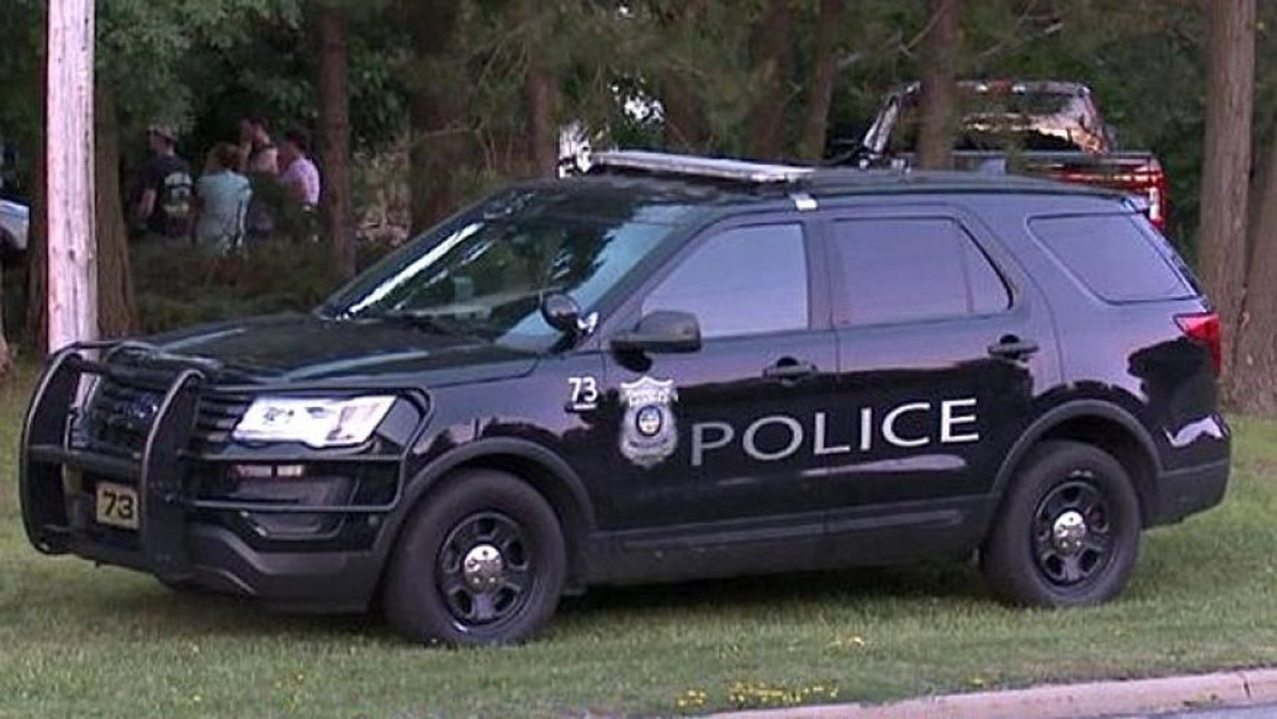 Authorities in Ohio said late Monday they were in a standoff at a home with the suspect in the triple murder of two college students and their mother.