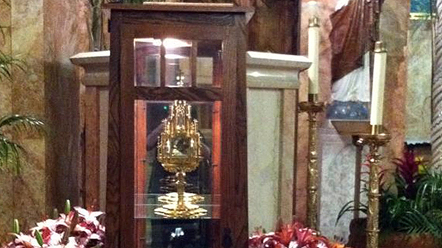 June 13: This undated photo provided by Father Brian Doran of the St. Anthony Catholic Church in Long Beach, Calif. via the Long Beach Police Department shows a 780-year-old religious relic of St. Anthony, the patron saint of lost causes and missing objects, center in cabinet, that was stolen from the church.