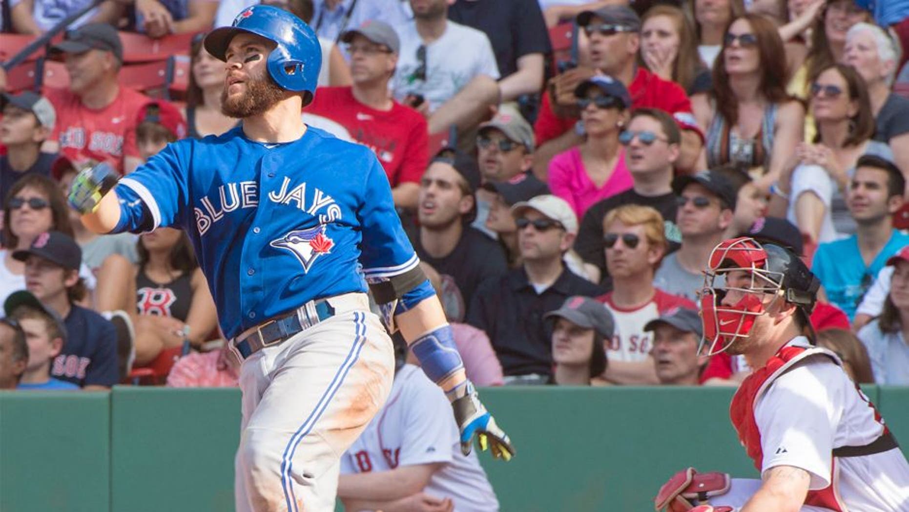 Jun 13, 2015; Boston, MA, USA; Toronto Blue Jays catcher Russell Martin (55) hits a home run during the eleventh inning of game against the Boston Red Sox at Fenway Park. The Blue Jays won 5-4. Mandatory Credit: Gregory J. Fisher-USA TODAY Sports