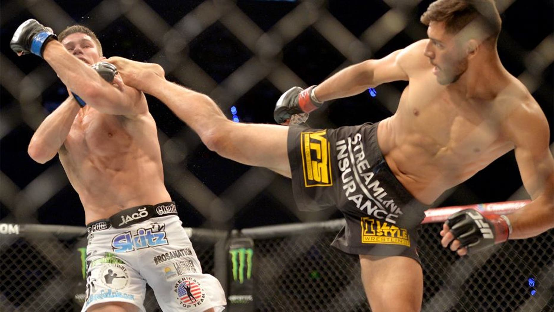 MEXICO CITY, MEXICO - JUNE 13: (R-L) Yair Rodriguez of Mexico kicks Charles Rosa of the United States in their featherweight bout during the UFC 188 event at the Arena Ciudad de Mexico on June 13, 2015 in Mexico City, Mexico. (Photo by Jeff Bottari/Zuffa LLC/Zuffa LLC via Getty Images)