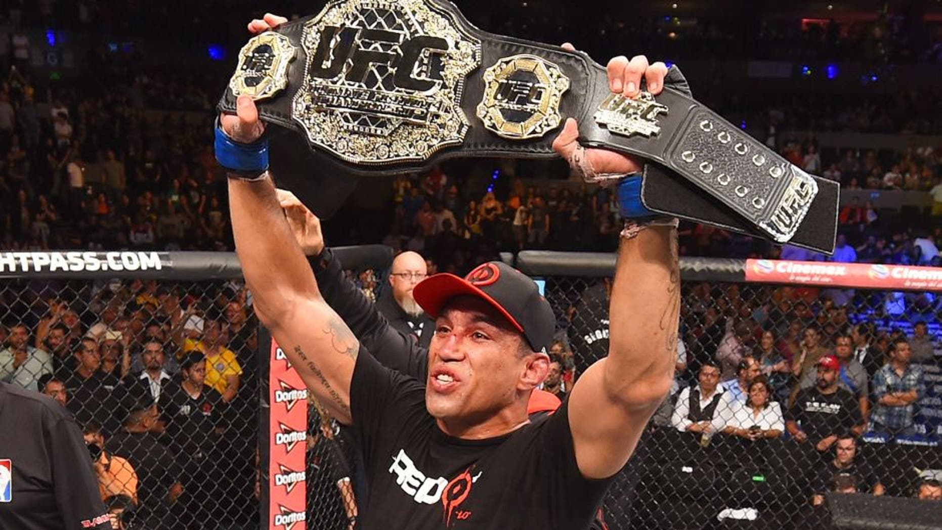 MEXICO CITY, MEXICO - JUNE 13: Fabricio Werdum of Brazil celebrates his submission victory over Cain Velasquez of the United States in their UFC heavyweight championship bout during the UFC 188 event inside the Arena Ciudad de Mexico on June 13, 2015 in Mexico City, Mexico. (Photo by Josh Hedges/Zuffa LLC/Zuffa LLC via Getty Images)