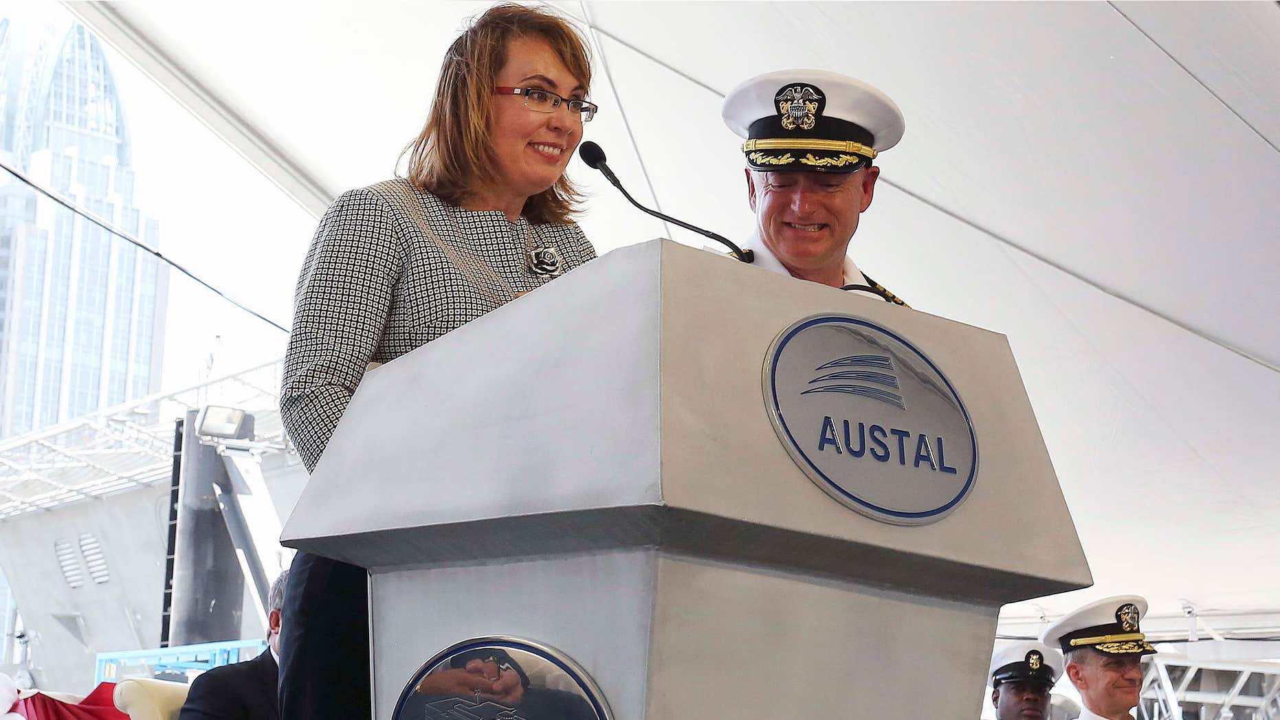 June 13, 2015: Former U.S. Rep. Gabrielle Giffords of Arizona delivers remarks with her husband, retired U.S. Navy Capt. Mark Kelly, by her side as the USS Gabrielle Giffords, a littoral combat ship built at the Austal USA shipyards is christened during a ceremony.