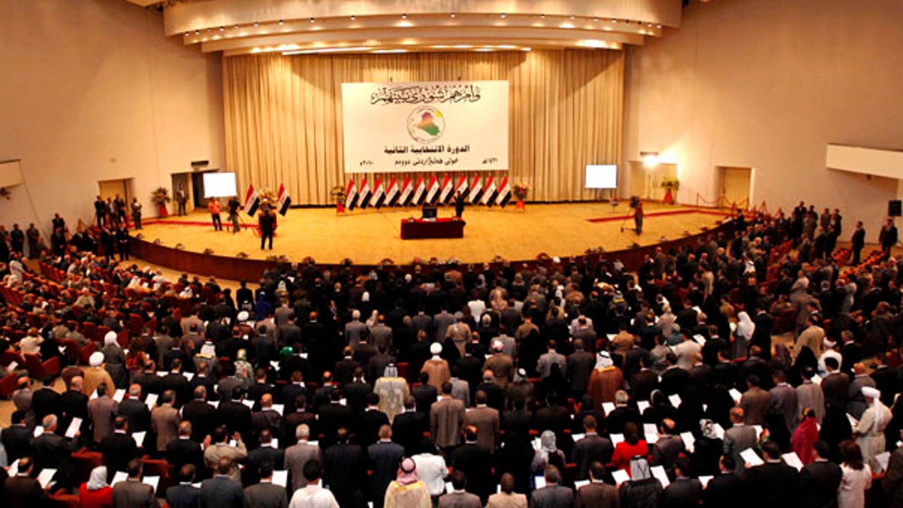 June 14: The members of the new Iraqi Parliament take the oath in the first session of Iraqi Parliament in Baghdad.