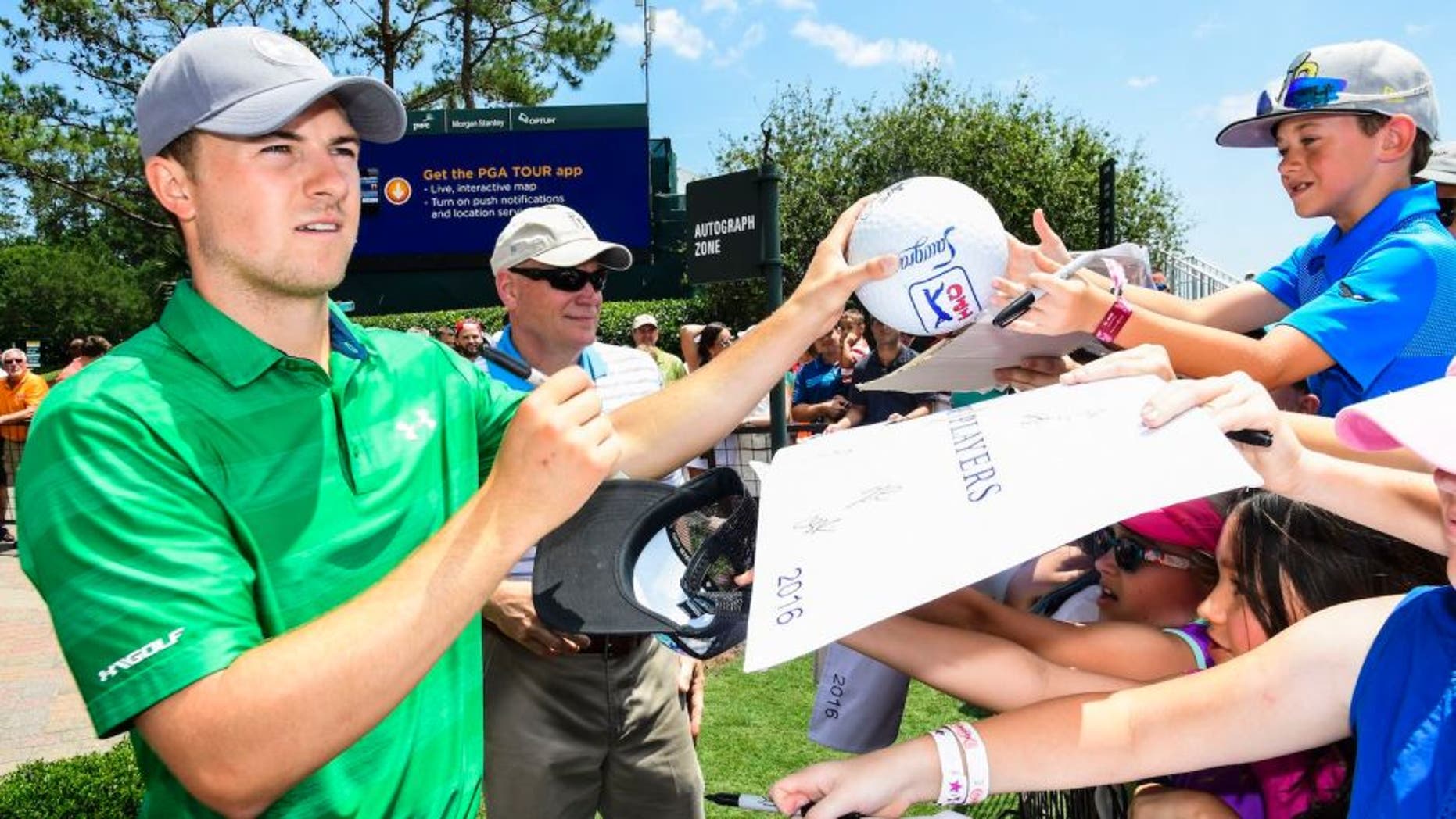 PONTE VEDRA BEACH, FL - MAY 10: Jordan Spieth signs autographs for fans ahead of THE PLAYERS Championship on THE PLAYERS Stadium Course at TPC Sawgrass on May 10, 2016. (Photo by Ryan Young/PGA TOUR)