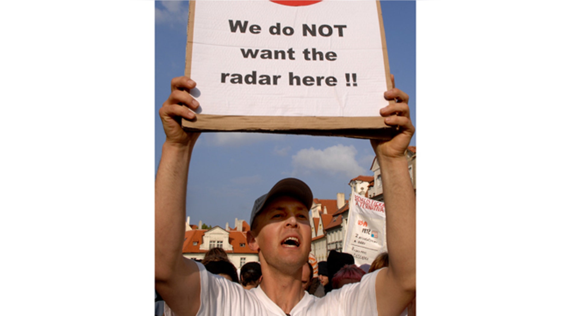 This June 4, 2007, file photo shows a Czech protester holding a banner against a possible radar base during a demonstration in Prague, Czech Republic.