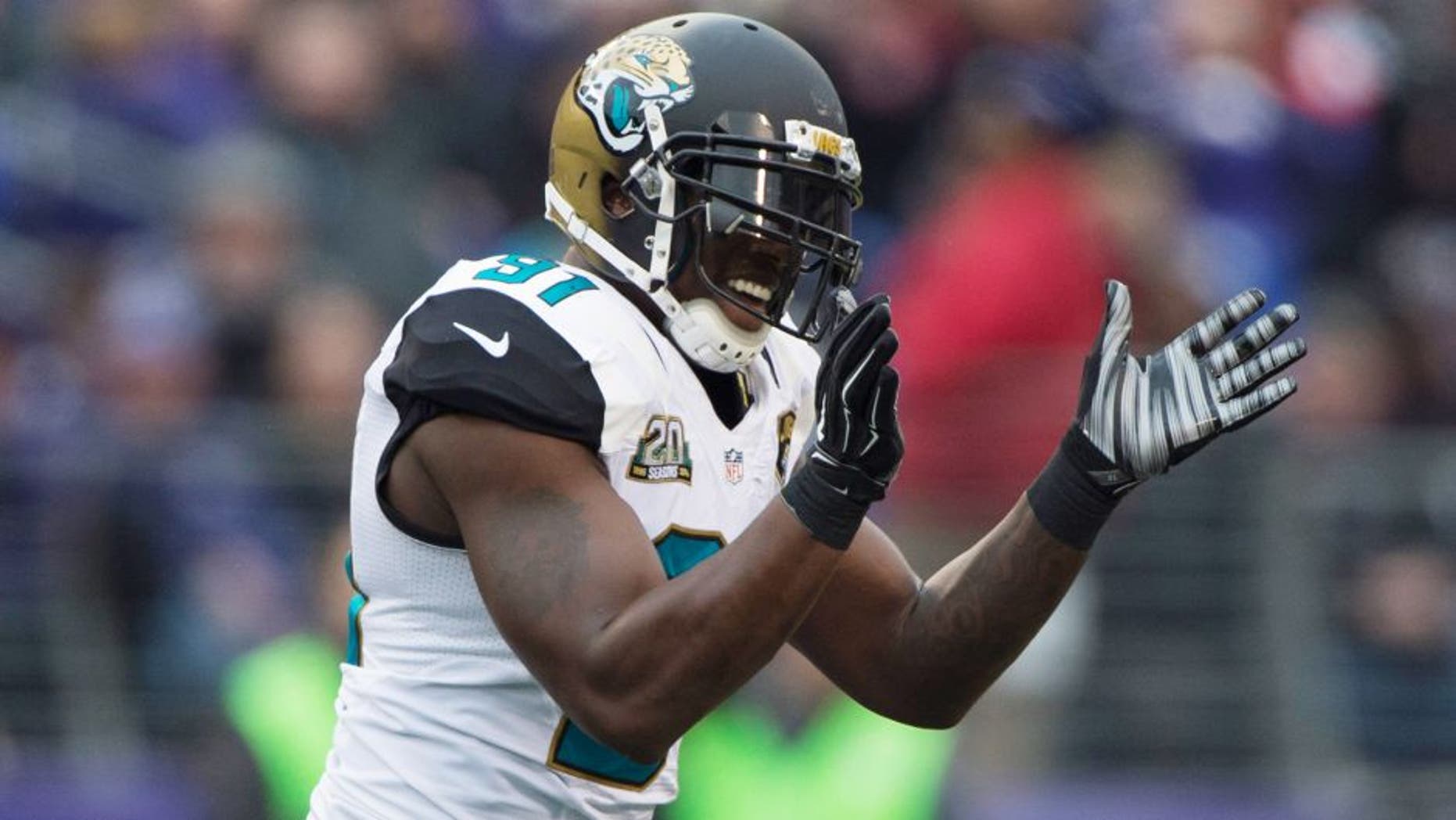 Dec 14, 2014; Baltimore, MD, USA; Jacksonville Jaguars defensive end Chris Clemons (91) celebrates after Baltimore Ravens kicker Justin Tucker (not pictured) missed a field goal during the second quarter at M&T Bank Stadium. Mandatory Credit: Tommy Gilligan-USA TODAY Sports