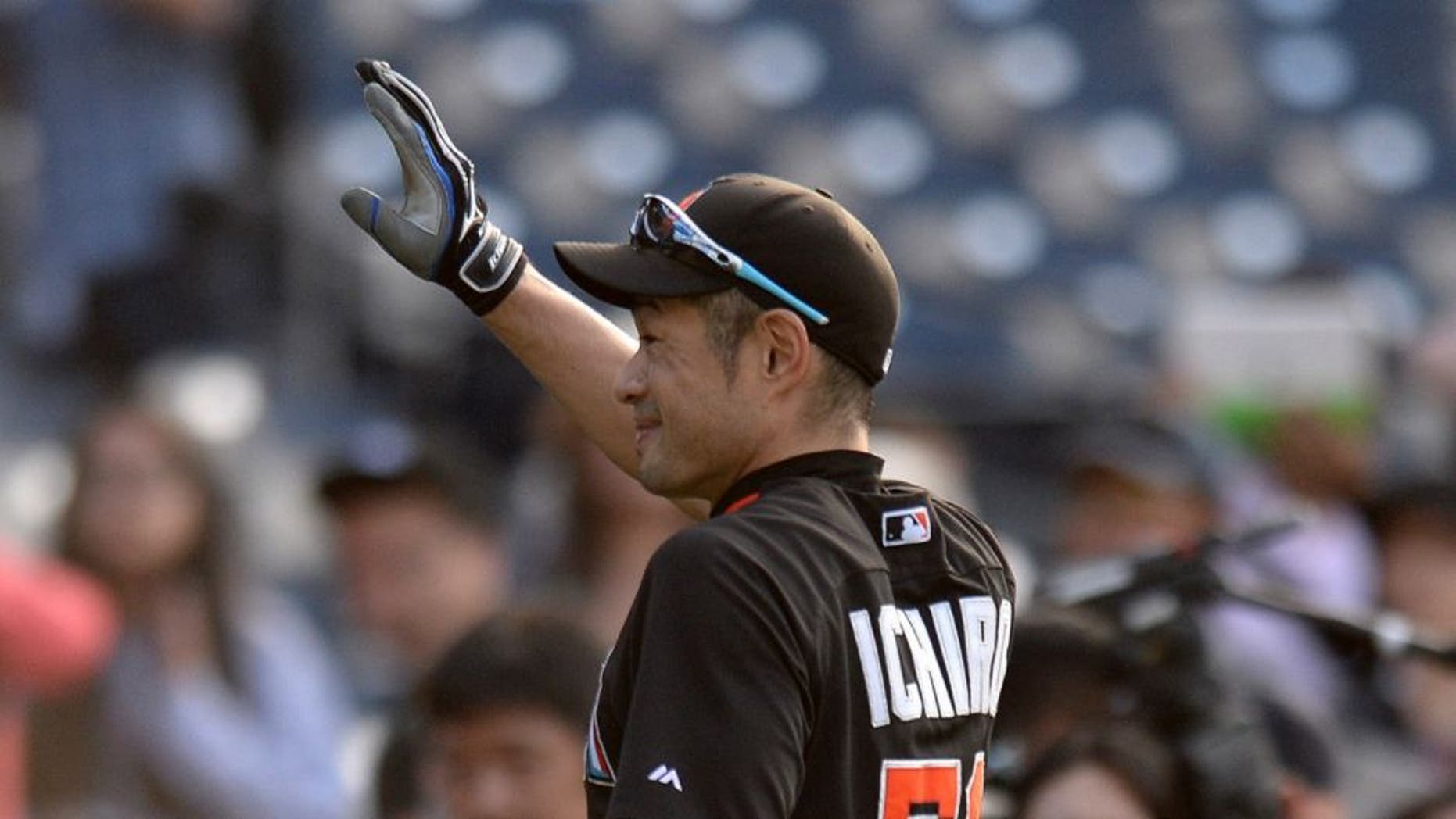Jun 14, 2016; San Diego, CA, USA; Miami Marlins center fielder Ichiro Suzuki (51) waves to the crowd prior to the game against the San Diego Padres at Petco Park. Mandatory Credit: Jake Roth-USA TODAY Sports