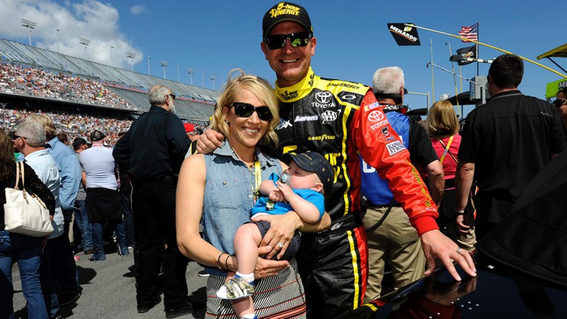 DAYTONA BEACH, FL - FEBRUARY 22: Clint Bowyer, driver of the #15 5-hour ENERGY Toyota, wife Lorra and son Cash Aaron pose for a picture on the grid prior to the NASCAR Sprint Cup Series 57th Annual Daytona 500 at Daytona International Speedway on February 22, 2015 in Daytona Beach, Florida. (Photo by Jared C. Tilton/Getty Images)