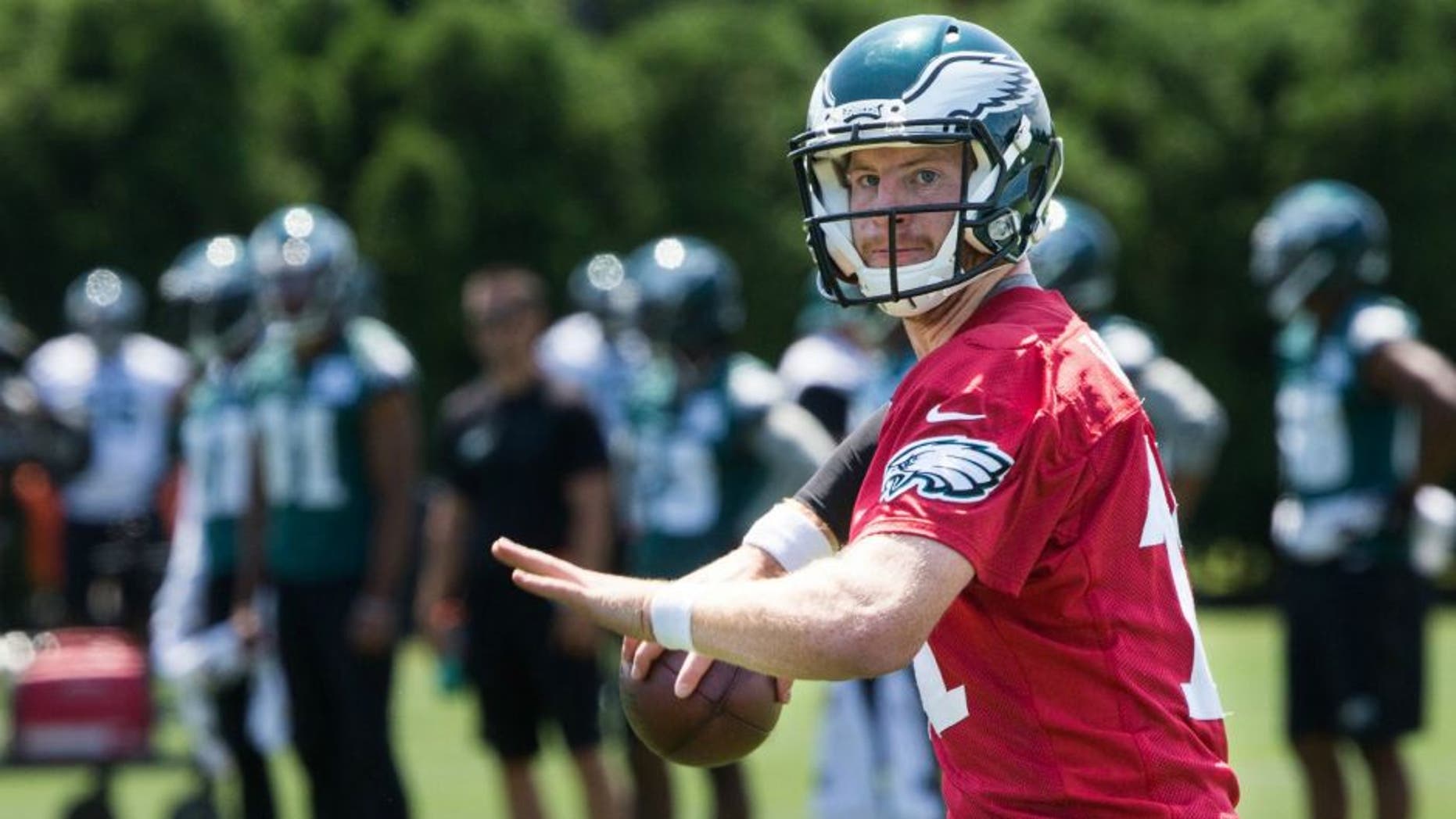 Jun 9, 2016; Philadelphia, PA, USA; Philadelphia Eagles quarterback Carson Wentz (11) passes during mini camp at NovaCare Complex. Mandatory Credit: Bill Streicher-USA TODAY Sports