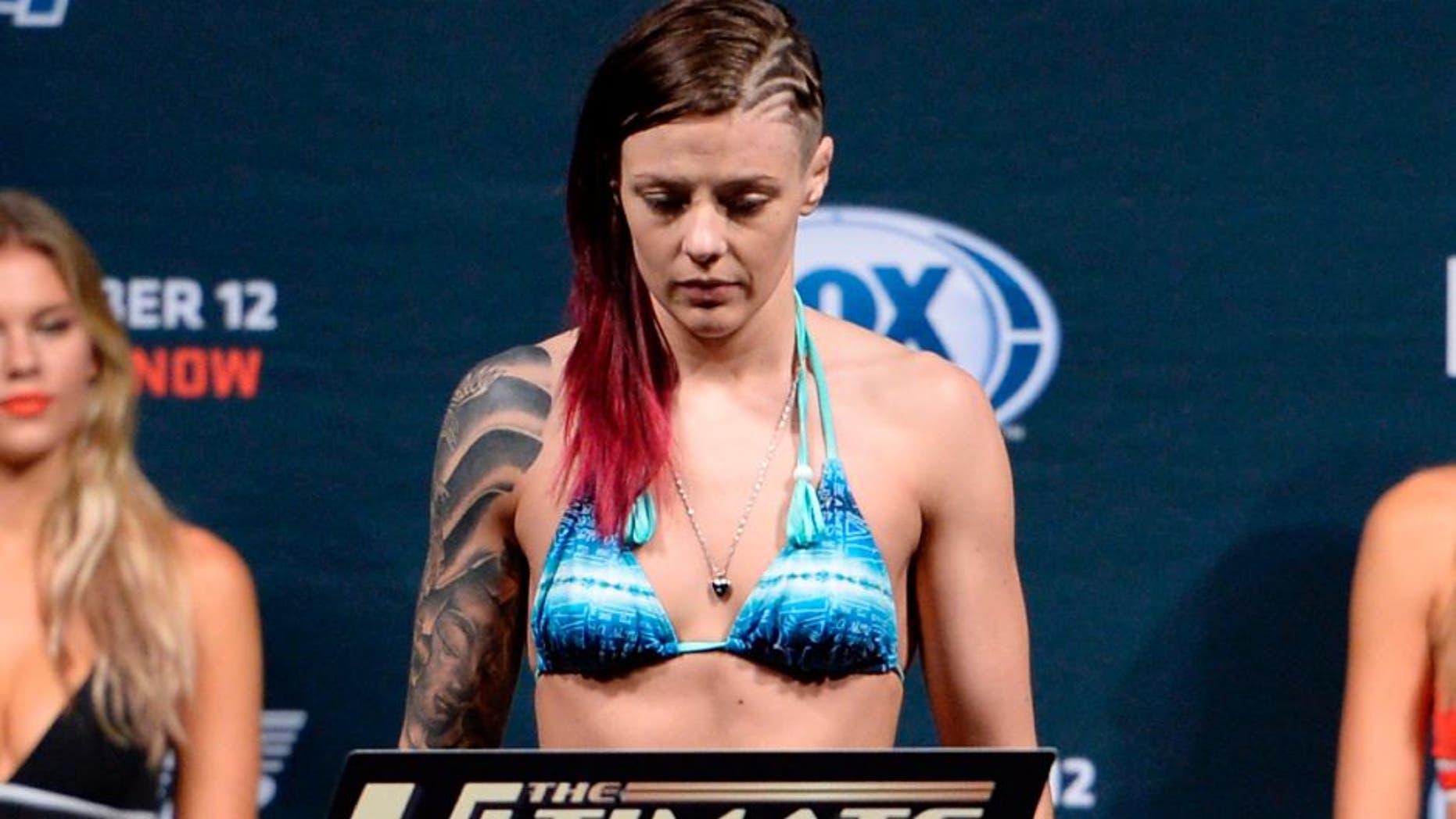 LAS VEGAS, NEVADA - DECEMBER 11: UFC strawweight Joanne Calderwood steps on the scale during The Ultimate Fighter Finale weigh-ins at the Palms Casino Resort on December 11, 2014 in Las Vegas, Nevada. (Photo by Jeff Bottari/Zuffa LLC/Zuffa LLC via Getty Images)