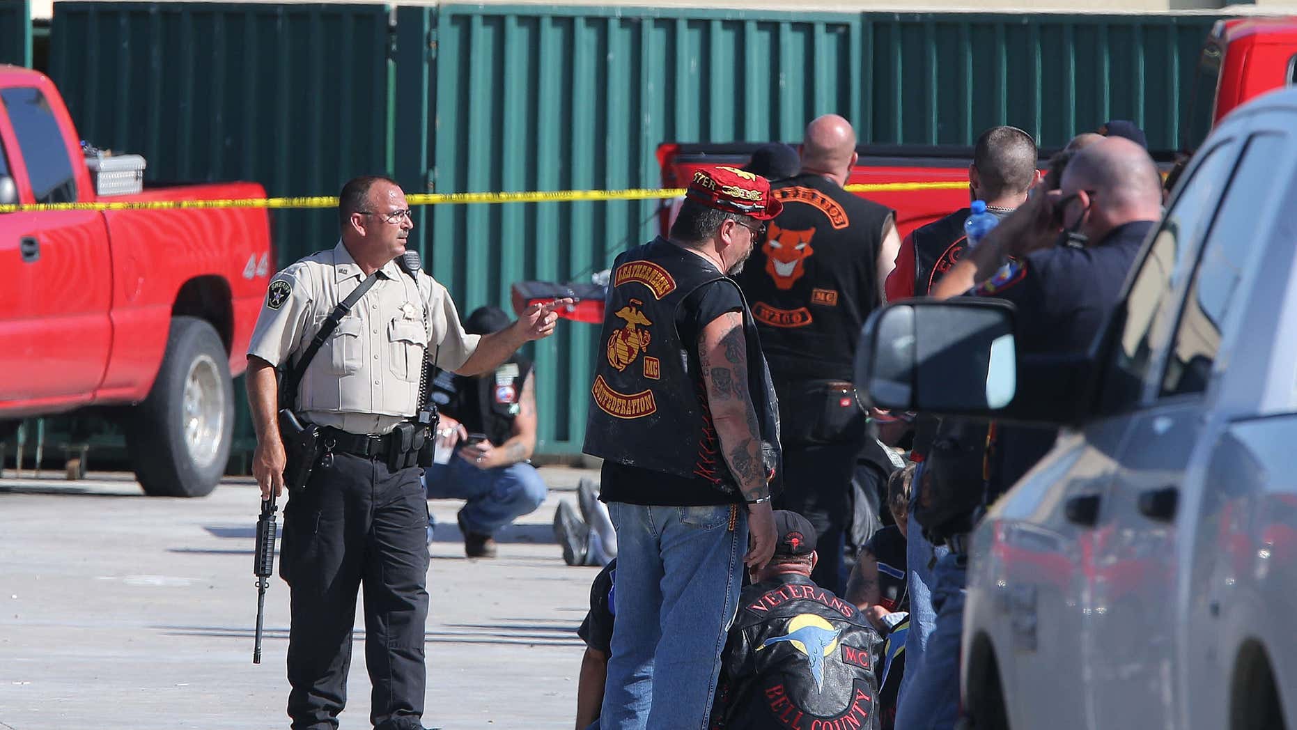 FILE - In this May 17, 2015, file photo, authorities investigate a shooting in the parking lot of the Twin Peaks restaurant in Waco, Texas.