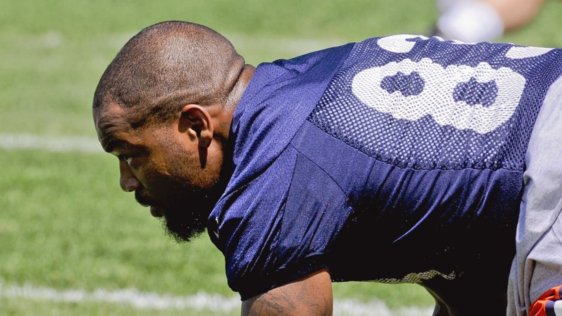 Chicago Bears tight end Martellus Bennett stretches during NFL football minicamp at Halas Hall, Tuesday, June 16, 2015, in Lake Forest, Ill. (AP Photo/Matt Marton)
