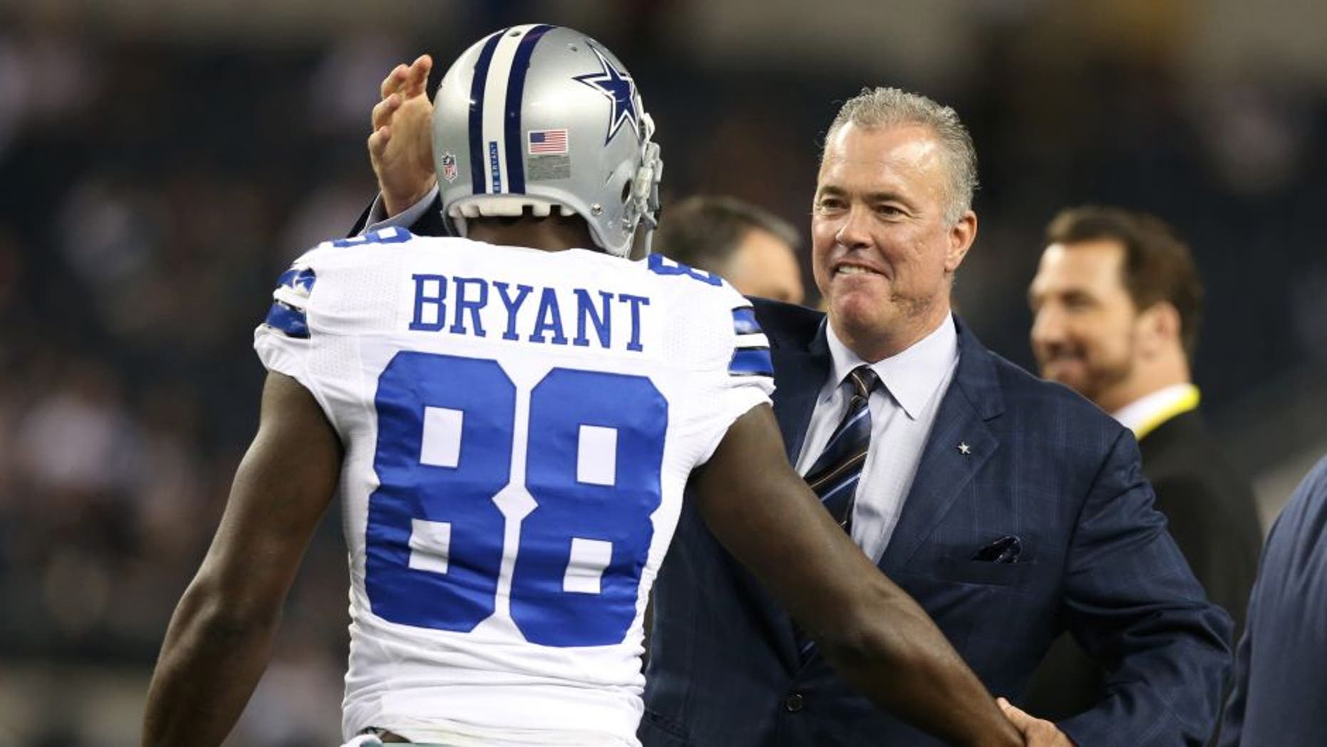 Dec 2, 2012; Arlington, TX, USA; Dallas Cowboys vice president Stephen Jones hugs receiver Dez Bryant (88) prior to the game against the Philadelphia Eagles at Cowboys Stadium. Mandatory Credit: Matthew Emmons-USA TODAY Sports