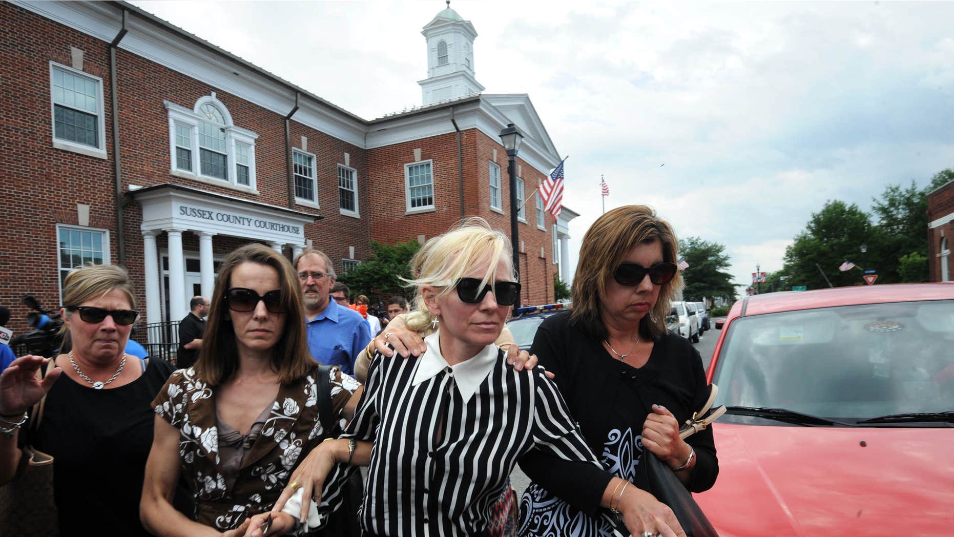 June 16, 2015: Ex-Baltimore Ravens cheerleader Molly Shattuck leaves Delaware courthouse.