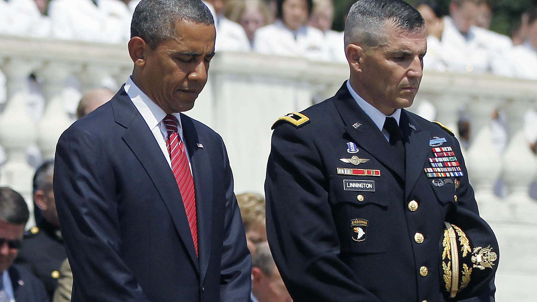 This May 28, 2012 file photo shows President Barack Obama standing with Maj. Gen. Michael S. Linnington, Commander of the U.S. Army Military District of Washington, during a Memorial Day wreath-laying ceremony at the Tomb of the Unknowns at Arlington National Cemetery in Arlington, Va.