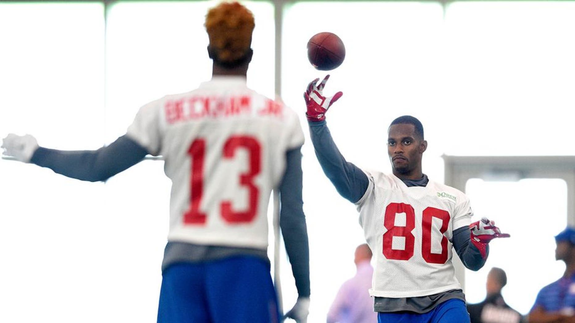 Jun 16, 2015; East Rutherford, NJ, USA; New York Giants wide receiver Odell Beckham Jr, (13) throws to wide receiver Victor Cruz (80) during minicamp at Quest Diagnostics Training Center. Mandatory Credit: Steven Ryan-USA TODAY Sports