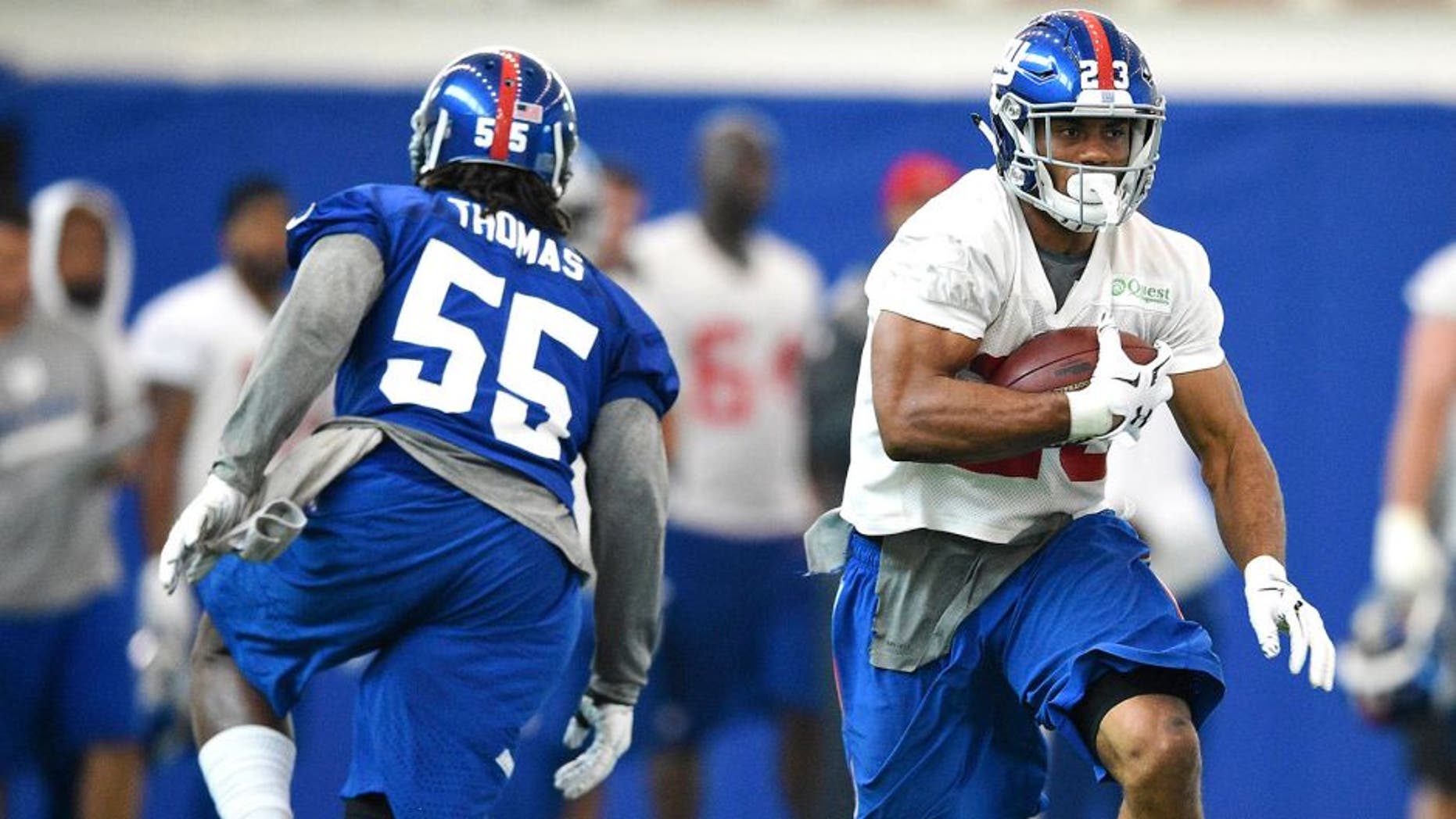 Jun 16, 2015; East Rutherford, NJ, USA; New York Giants running back Rashad Jennings (23) runs the ball during minicamp at Quest Diagnostics Training Center. Mandatory Credit: Steven Ryan-USA TODAY Sports