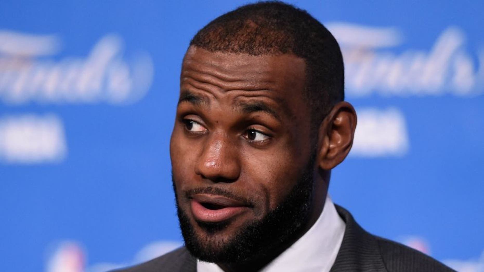 Jun 16, 2016; Cleveland, OH, USA; Cleveland Cavaliers forward LeBron James (23) speaks to the media after game six of the NBA Finals against the Golden State Warriors at Quicken Loans Arena. The Cavaliers won 115-101. Mandatory Credit: David Richard-USA TODAY Sports