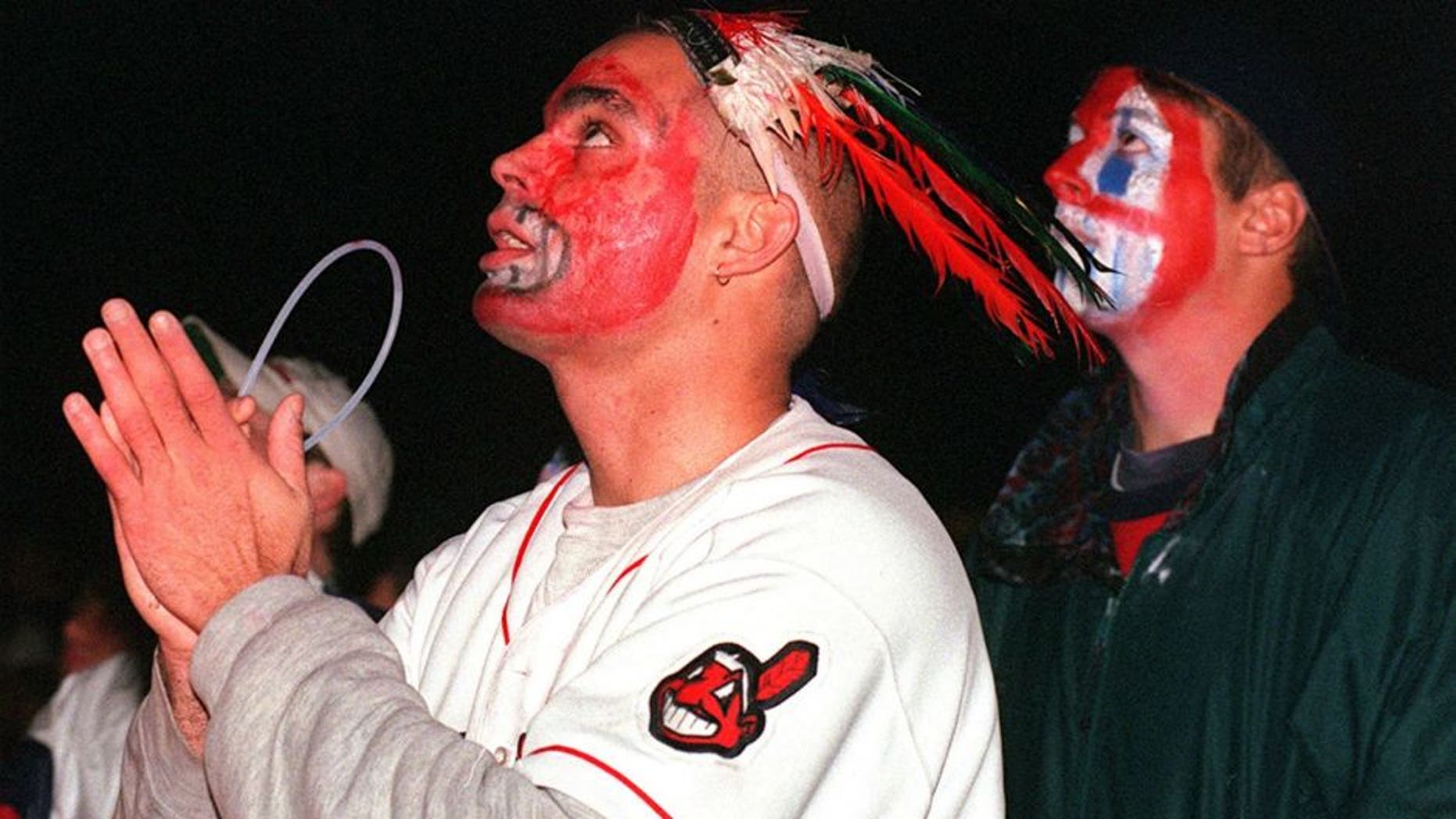 CLEVELAND, OH - OCTOBER 27: Cleveland Indians fans Pedro Rodriguez(L) and Pete Bogdan(R) watch the Indians play the Florida Marlins in game 7 of the World Series 26 October in downtown Cleveland. The Marlins defeated the Indians, 3-2, in 11 innings to win the 1997 World Series. (Photo credit should read KIMBERLY BARTH/AFP/Getty Images)