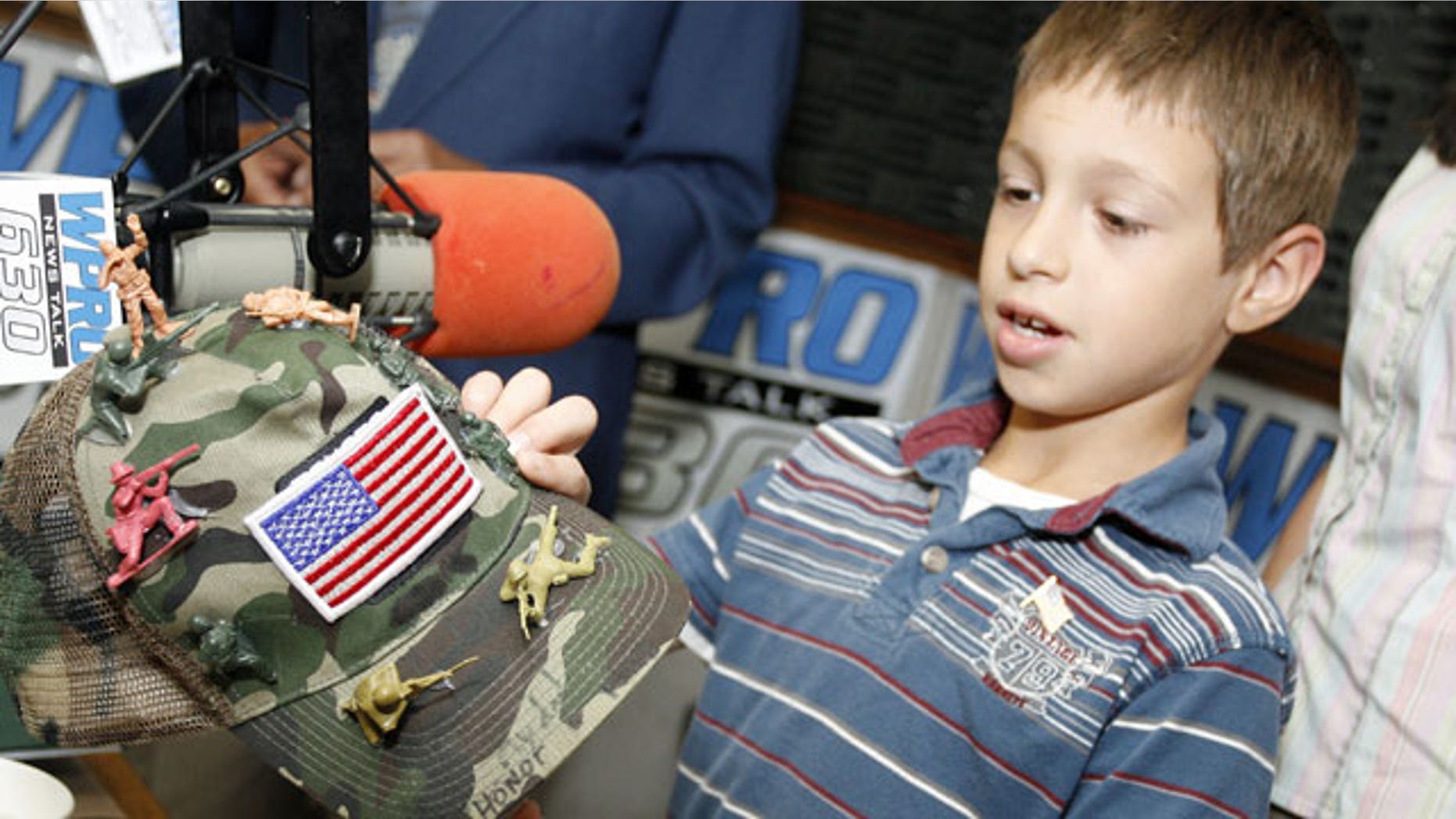 June 18: David Morales, 8, from Coventry, R.I., shows his decorated army hat during an appearance on WPRO-AM's John DePetro radio show in East Providence, R.I.