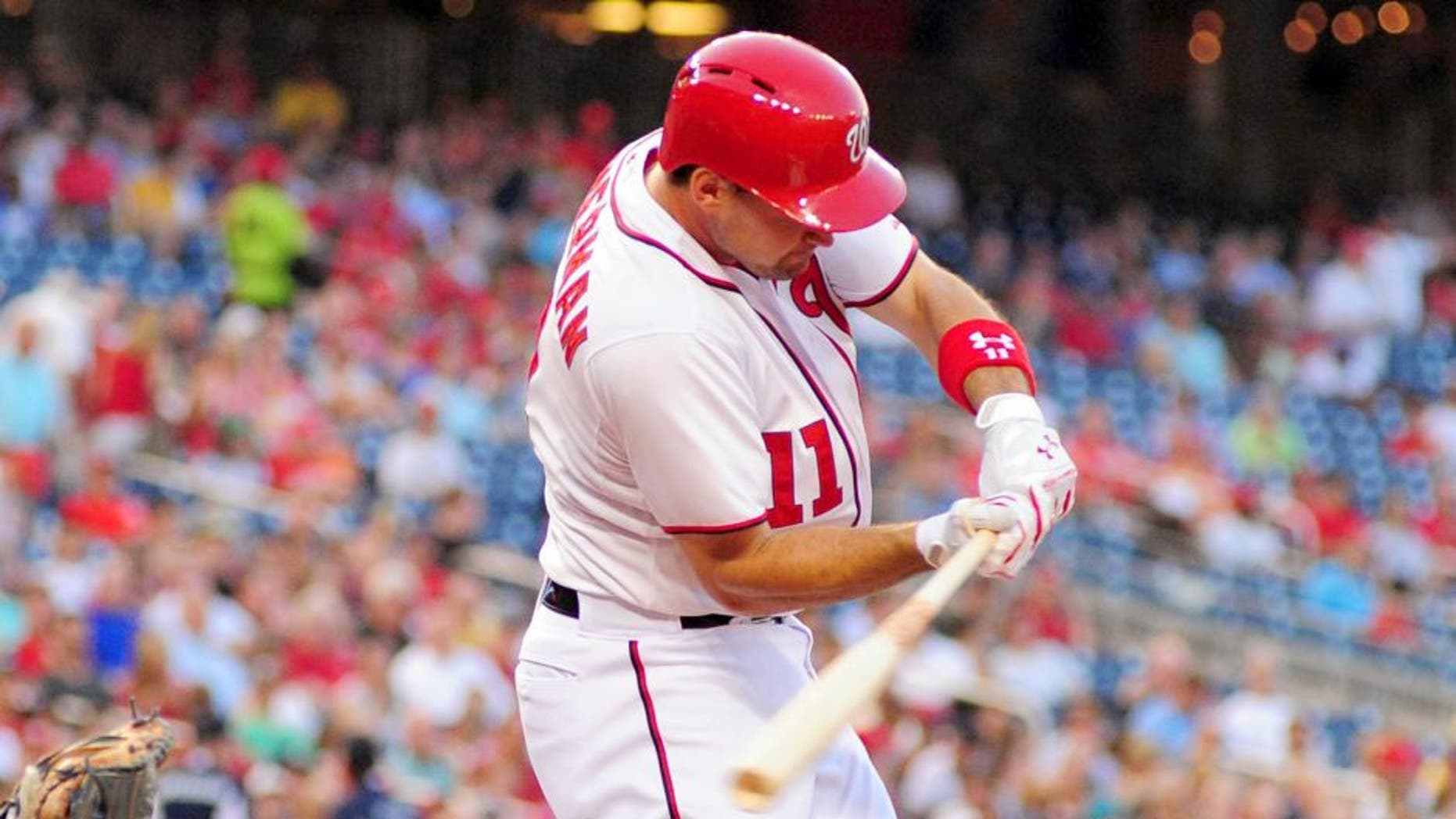 Jun 17, 2014; Washington, DC, USA; Washington Nationals outfielder Ryan Zimmerman (11) hits an RBI double in the third inning against the Houston Astros at Nationals Park. Mandatory Credit: Evan Habeeb-USA TODAY Sports