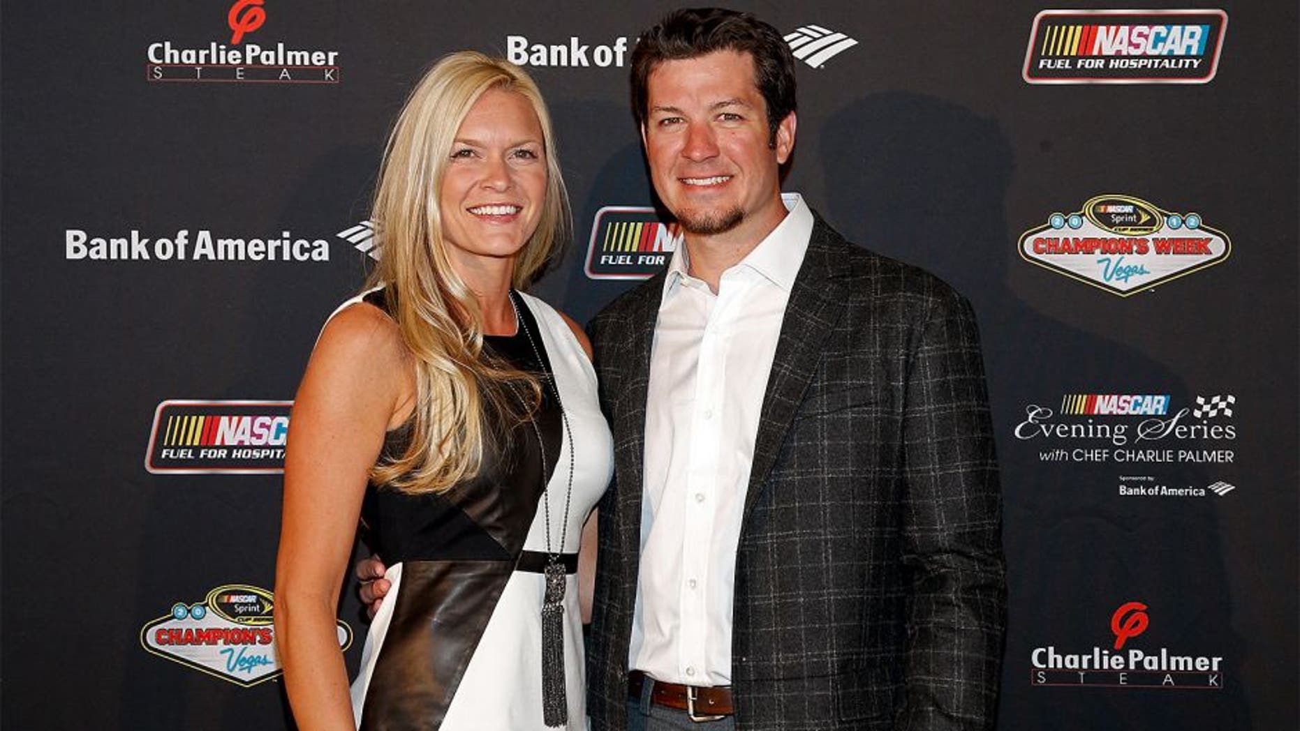 LAS VEGAS, NV - NOVEMBER 28: Driver Martin Truex Jr. (R) and Sherry Pollex (L) pose during the NASCAR Evening Series at Charlie Palmer Steak part of the Four Seasons Hotel Las Vegas on November 28, 2012 in Las Vegas, Nevada. (Photo by Chris Graythen/Getty Images for NASCAR)