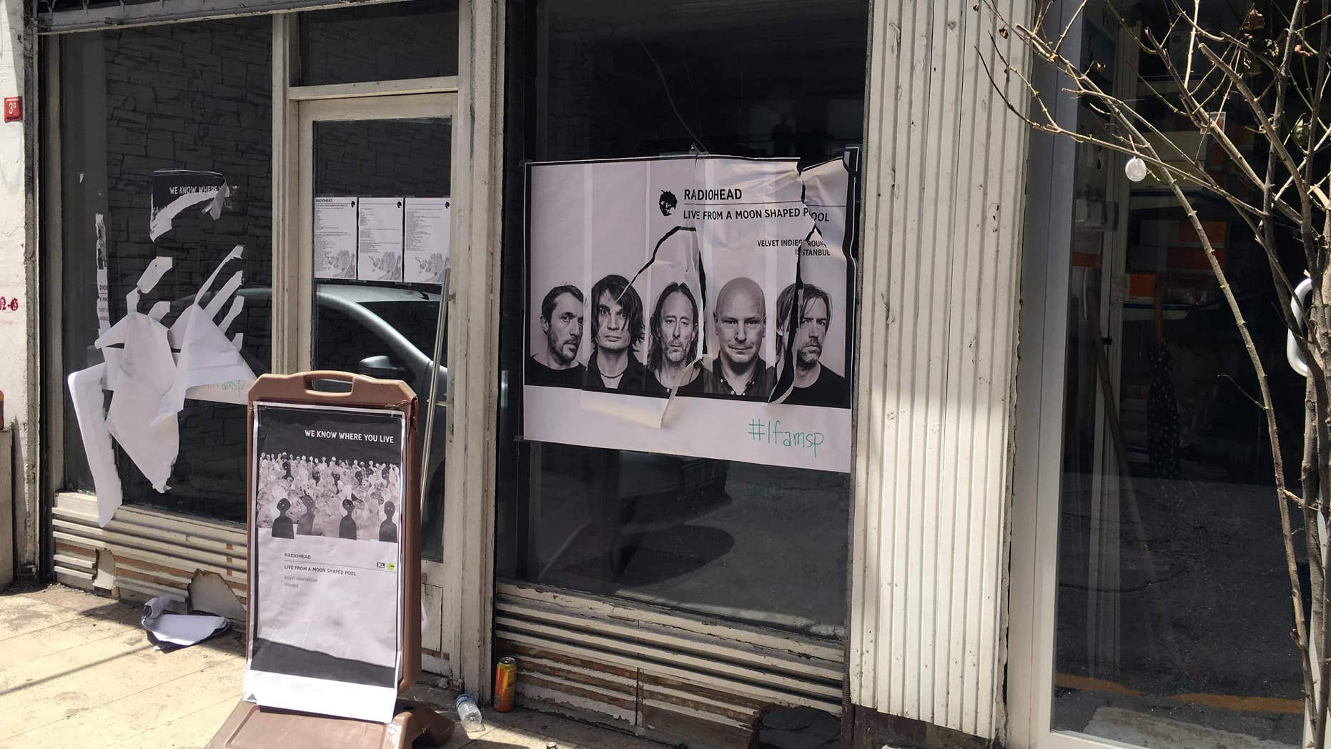 June 18, 2016: A ripped up poster advertising the streaming event of Radiohead's new album, at a record shop, in Istanbul.
