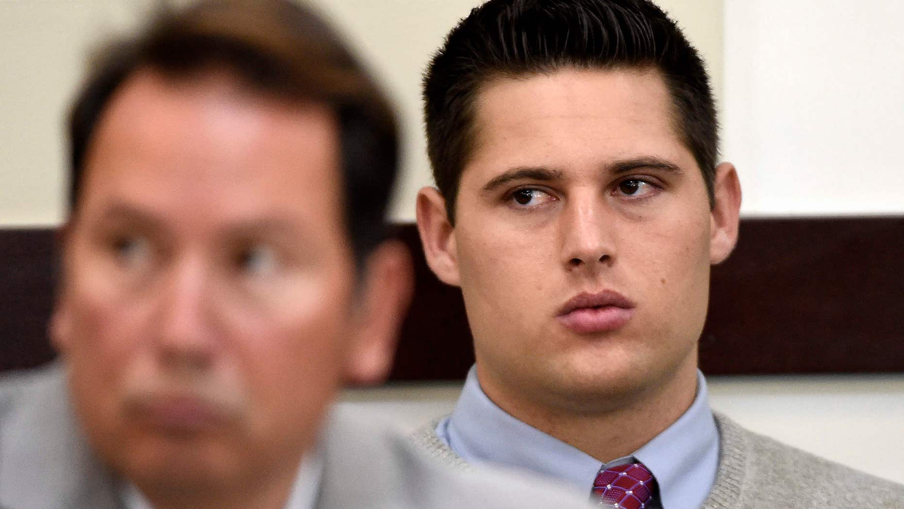 Brandon Vandenburg, right, a former Vanderbilt football player, listens during his rape trial Saturday, June 18, 2016, in Nashville, Tenn.