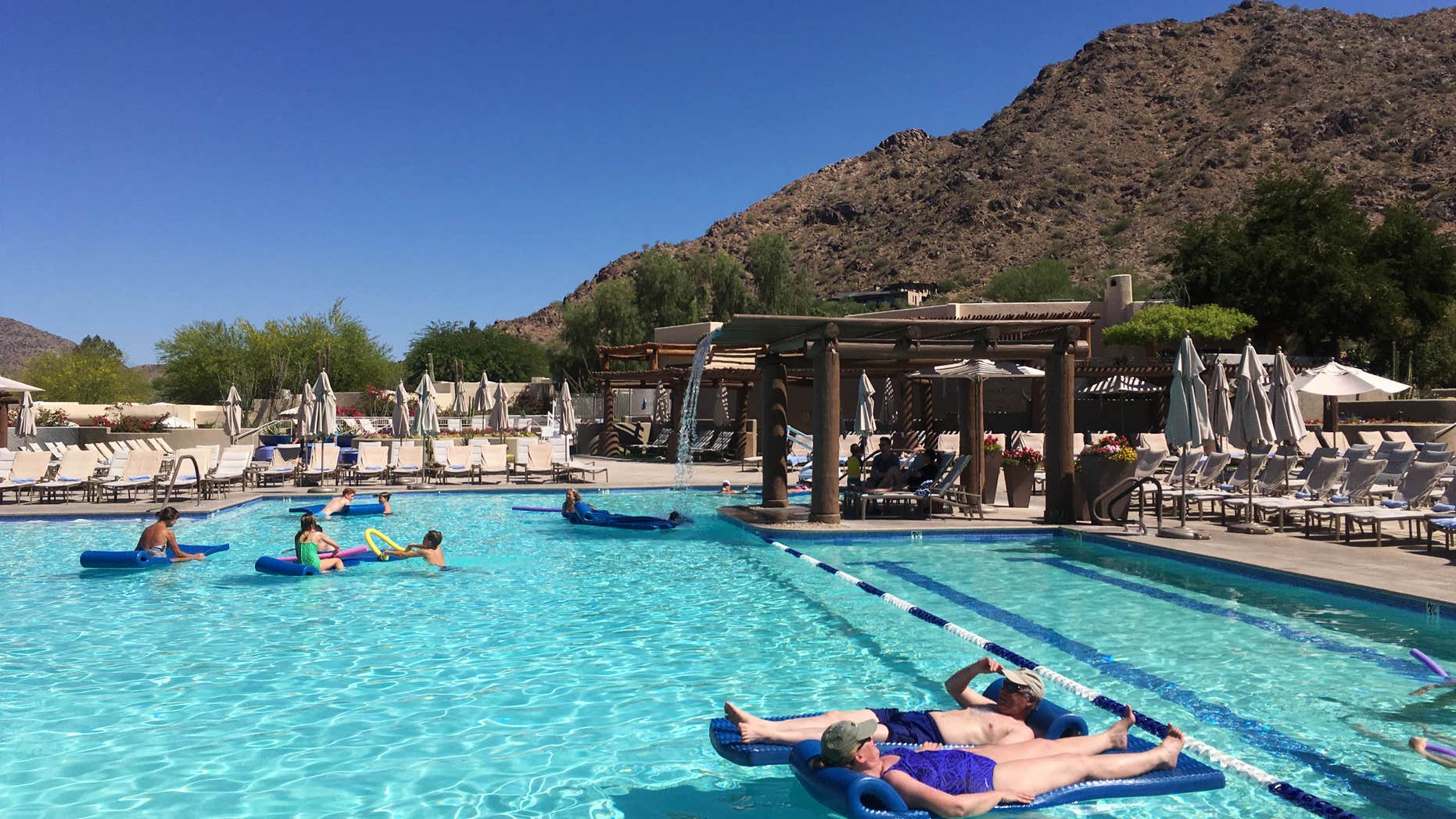 June 19, 2016: Hotel guests cool off at the pool at the JW Marriott Scottsdale Camelback Inn Resort and Spa in Paradise Valley, Ariz.