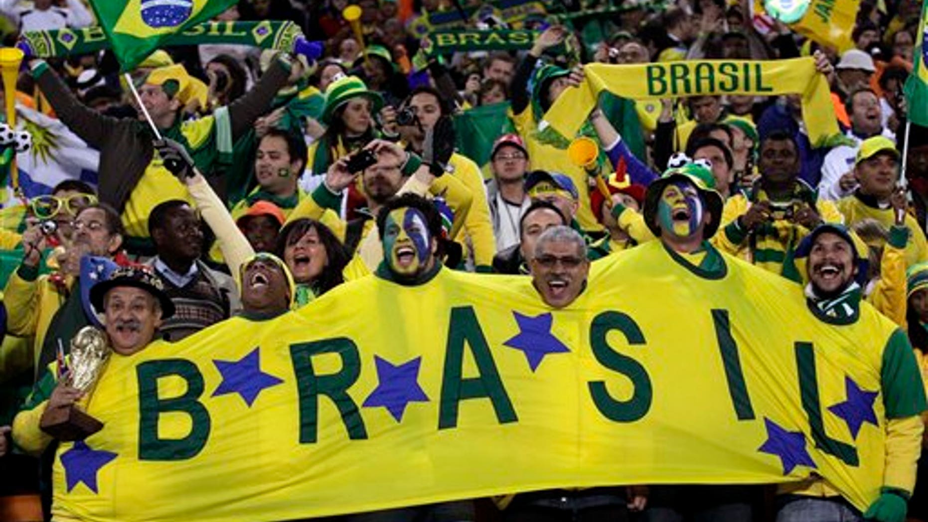 Brazil fans cheers prior to the World Cup group G soccer match between Brazil and Ivory Coast at Soccer City in Johannesburg, South Africa, Sunday, June 20, 2010. (AP Photo/Frank Augstein)