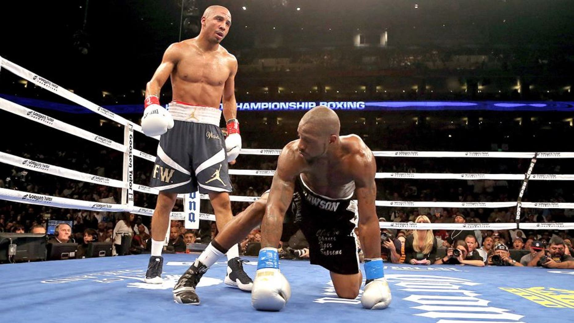 OAKLAND, CA - SEPTEMBER 08: Andre Ward (L) stands over Chad Dawson after he knocked him down in the third round of their WBA/WBC Super Middleweight championship fight at ORACLE Arena on September 8, 2012 in Oakland, California. Ward won by TKO in the 10th round. (Photo by Ezra Shaw/Getty Images)
