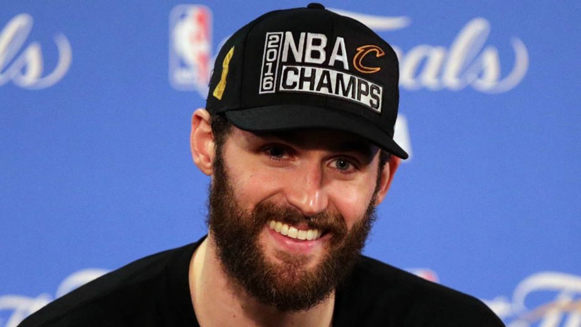 June 19, 2016; Oakland, CA, USA; Cleveland Cavaliers forward Kevin Love (0) speaks to media following the 93-89 victory against the Golden State Warriors in game seven of the NBA Finals at Oracle Arena. Mandatory Credit: Kelley L Cox-USA TODAY Sports
