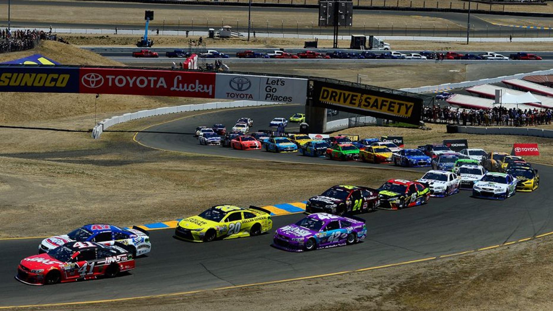 SONOMA, CA - JUNE 28: Kurt Busch, driver of the #41 Haas Automation Chevrolet, and AJ Allmendinger, driver of the #47 Kingsford Charcoal Chevrolet, lead the field at the start of the NASCAR Sprint Cup Series Toyota/Save Mart 350 at Sonoma Raceway on June 28, 2015 in Sonoma, California. (Photo by Robert Laberge/Getty Images)