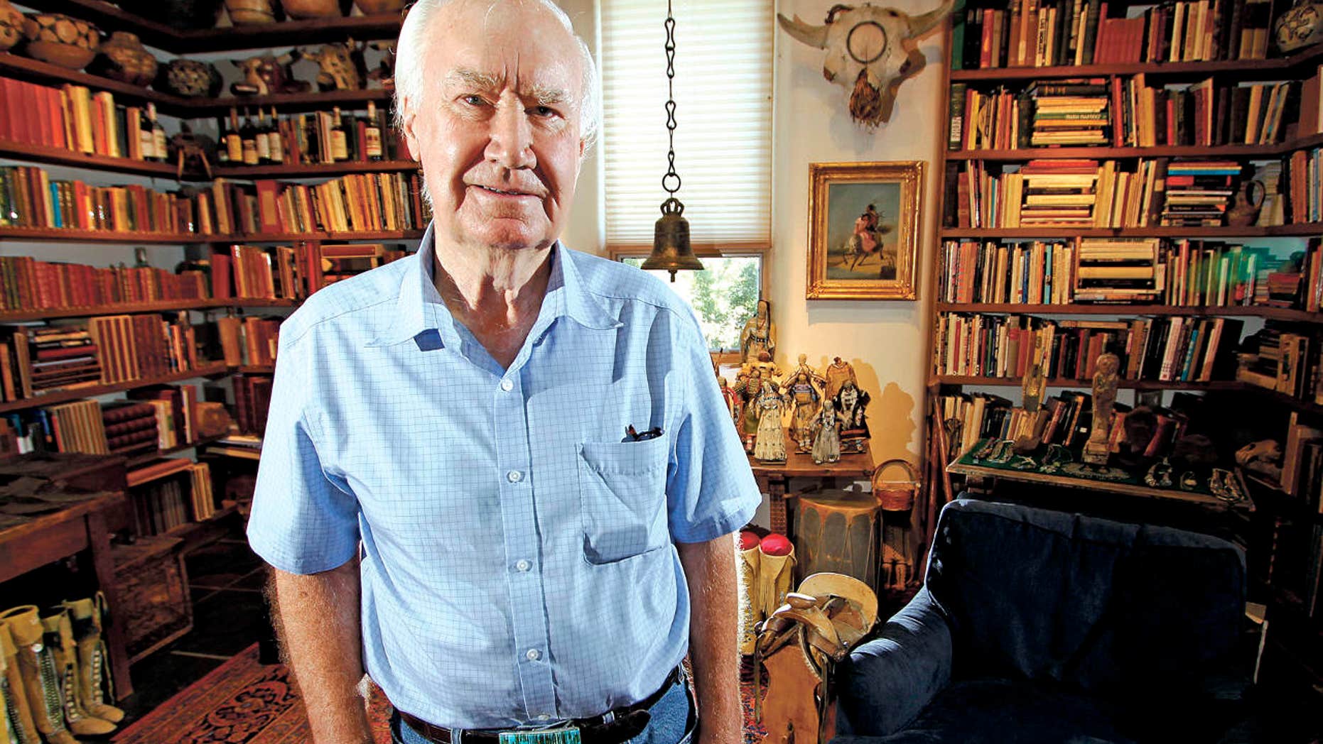 In this July 4, 2014 photo, Forrest Fenn poses at his Santa Fe, N.M., home.