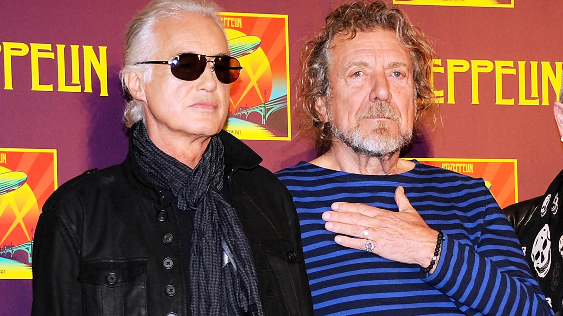 FILE - In this Oct. 9, 2012 file photo, Led Zeppelin guitarist Jimmy Page, left, and singer Robert Plant appear at a press conference ahead of the worldwide theatrical release of "Celebration Day," a concert film of their 2007 London O2 arena reunion show, in New York.