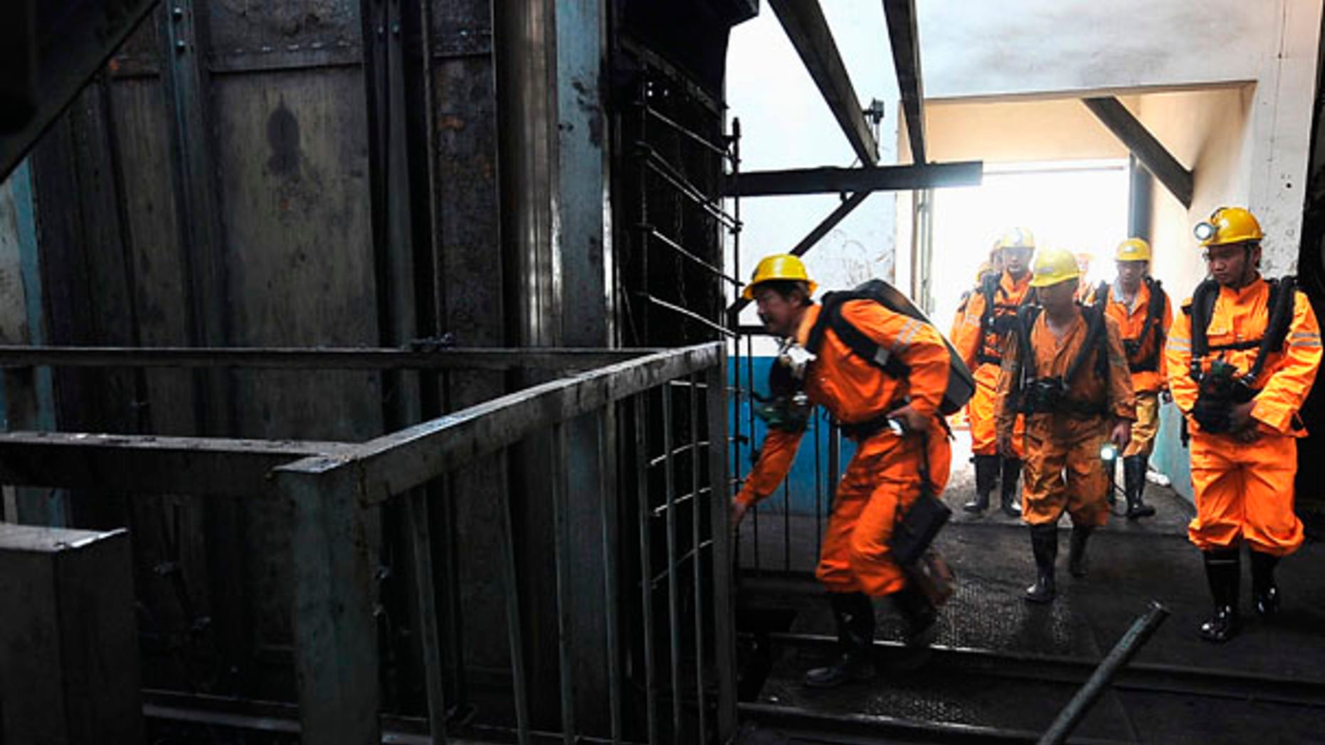 Rescue workers prepare to search for missing miners after a blast at the Xingdong No.2 Coal Mine in Pingdingshan city in central China's Henan province on Monday, June 21, 2010. State media say at least 46 miners were killed when an explosion ripped through the coal mine. (AP Photo)**CHINA OUT**