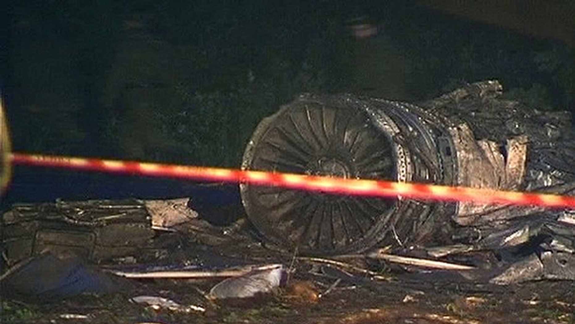June 21: Personnel from the Russian emergency services walk at the site of a plane crash about 1 km (0.6 miles) from the runway at the airport outside the northern Russian city of Petrozavodsk in this still image taken from video footage.