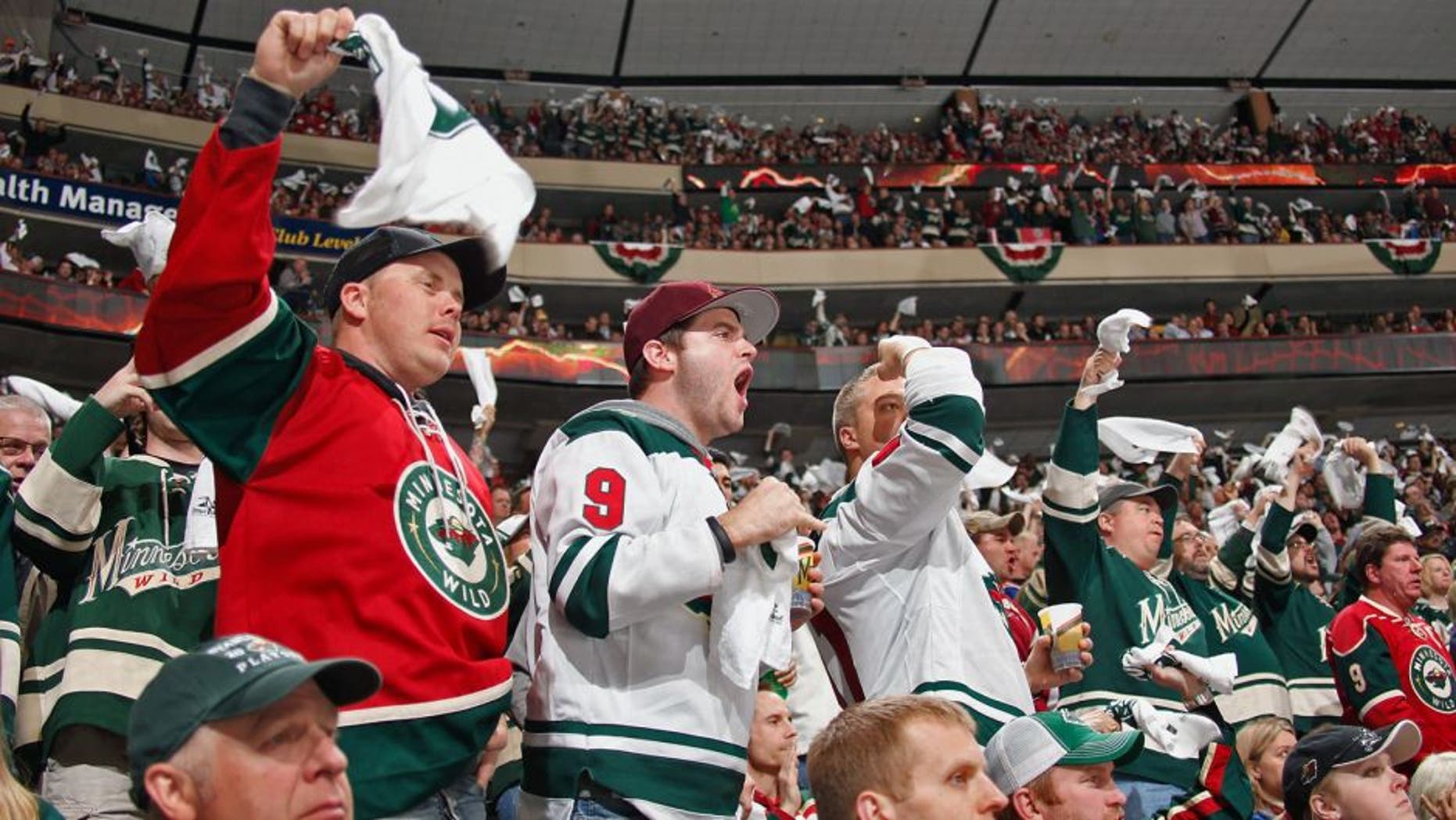 ST. PAUL, MN - APRIL 28: Minnesota Wild fans cheer on their team against the Colorado Avalanche during Game Six of the First Round of the 2014 Stanley Cup Playoffs on April 28, 2014 at the Xcel Energy Center in St. Paul, Minnesota. (Photo by Bruce Kluckhohn/NHLI via Getty Images)