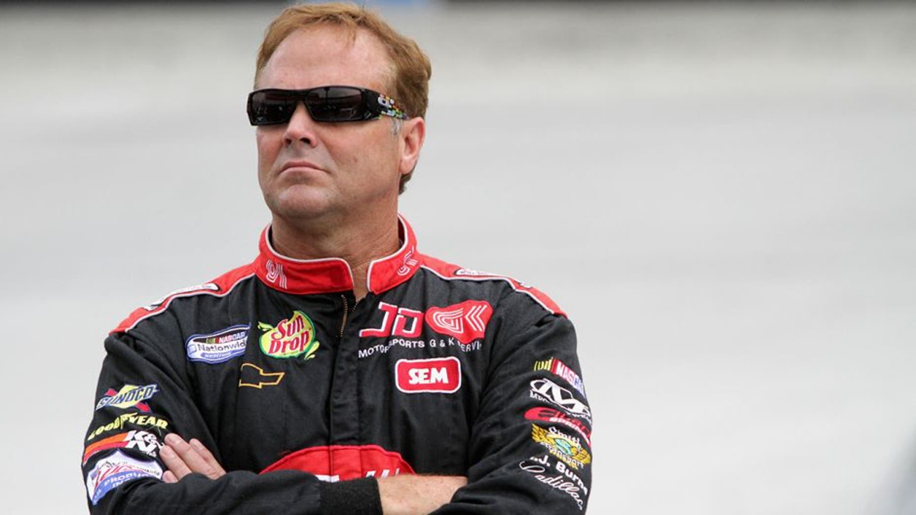 BRISTOL, TN - AUGUST 23: Mike Wallace, driver of the #01 teamjdmotorsports.com Chevrolet, looks on from the grid during qualifying for the NASCAR Nationwide Series Food City 250 at Bristol Motor Speedway on August 23, 2013 in Bristol, Tennessee. (Photo by Jerry Markland/Getty Images)