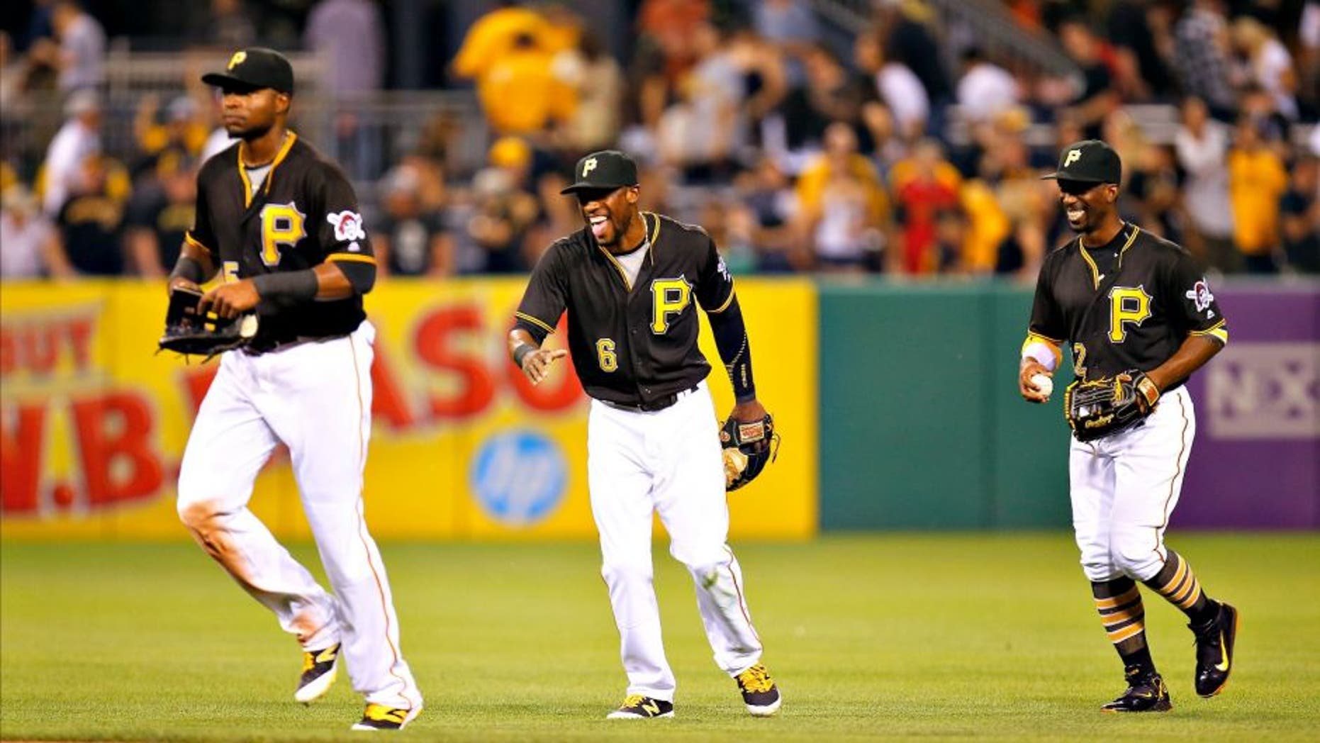 PITTSBURGH, PA - JUNE 20: Andrew McCutchen #22, Starling Marte #6 and Gregory Polanco #25 of the Pittsburgh Pirates celebrate after defeating the San Francisco Giants 1-0 at PNC Park on June 20, 2016 in Pittsburgh, Pennsylvania. (Photo by Justin K. Aller/Getty Images)