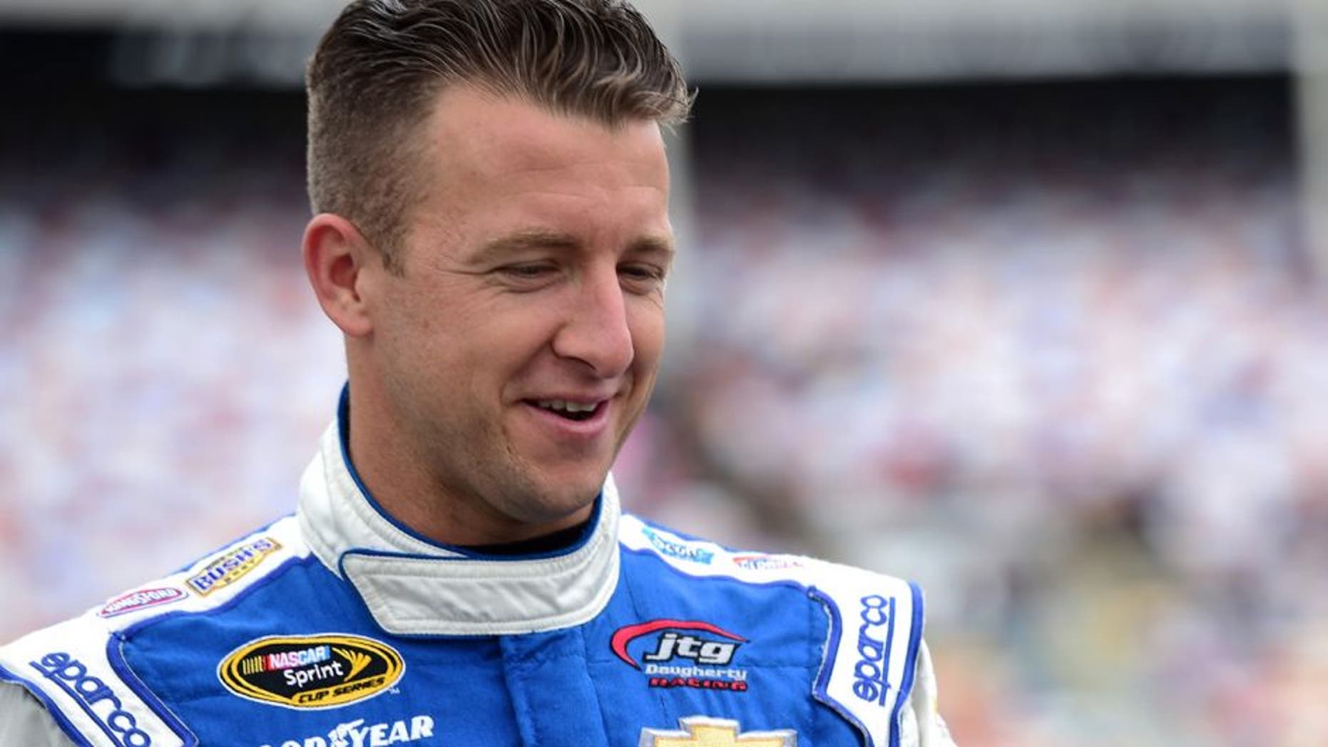 CHARLOTTE, NC - MAY 21: AJ Allmendinger, driver of the #47 Uwharrie Bank Chevrolet, walks on the grid during the NASCAR Sprint Cup Series Sprint Showdown at Charlotte Motor Speedway on May 21, 2016 in Charlotte, North Carolina. (Photo by Jared C. Tilton/Getty Images)