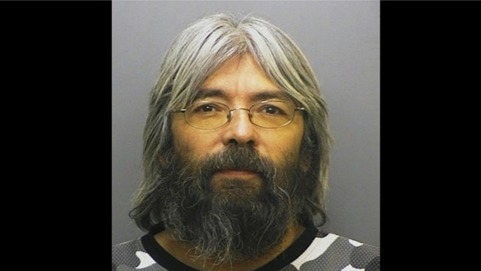 This Jan. 2006 file photo provided by the Larimer County, Colo. Sheriff's Office shows Gary Brooks Faulkner, after he was arrested on a Compulsory Insurance charge.