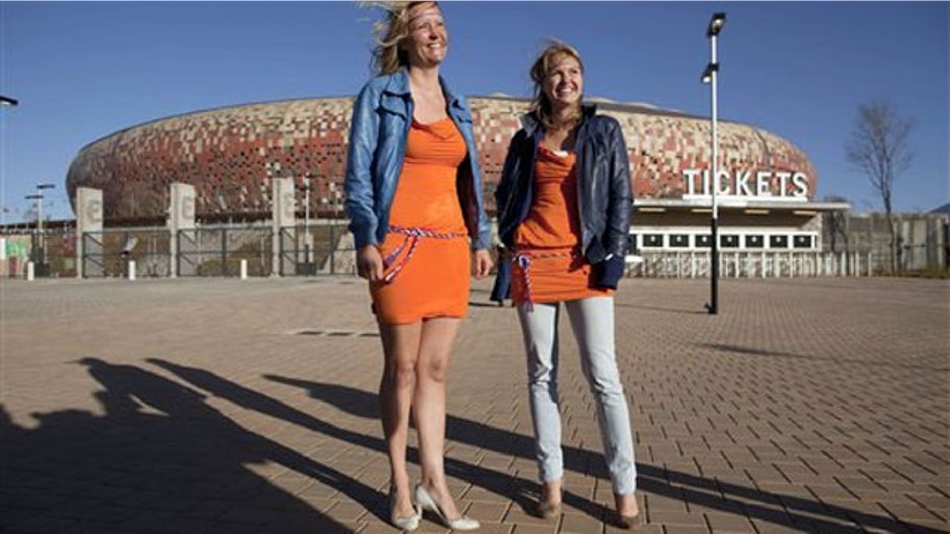 June 15: Barbara Castelein, left, and Mierte, both from the Netherlands, outside the Soccer City stadium in Johannesburg, where they were arrested for wearing orange mini-dresses that are the symbol of a beer advertising campaign in the Netherlands.