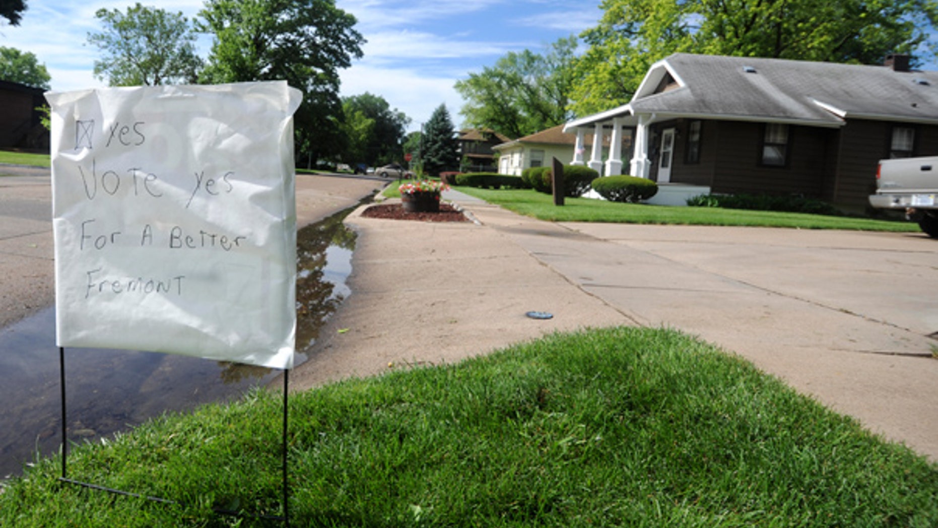 June 21: A home-made sign urges residents to vote yes on a proposed municipal ordinance that would ban hiring or renting property to illegal immigrants in the city of Fremont, Nebraska.