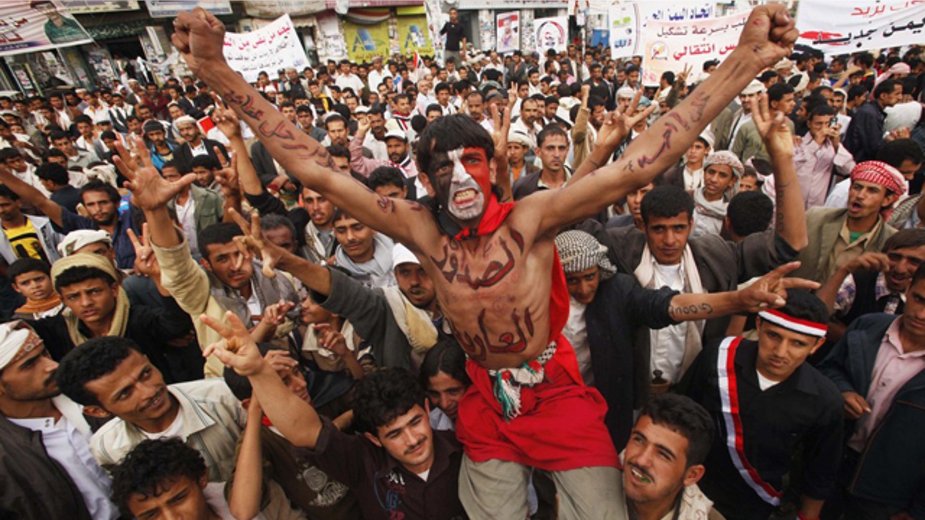 June 21: Anti-government protesters shout slogans during a demonstration to demand the ouster of Yemen's President Ali Abdullah Saleh in Sanaa.