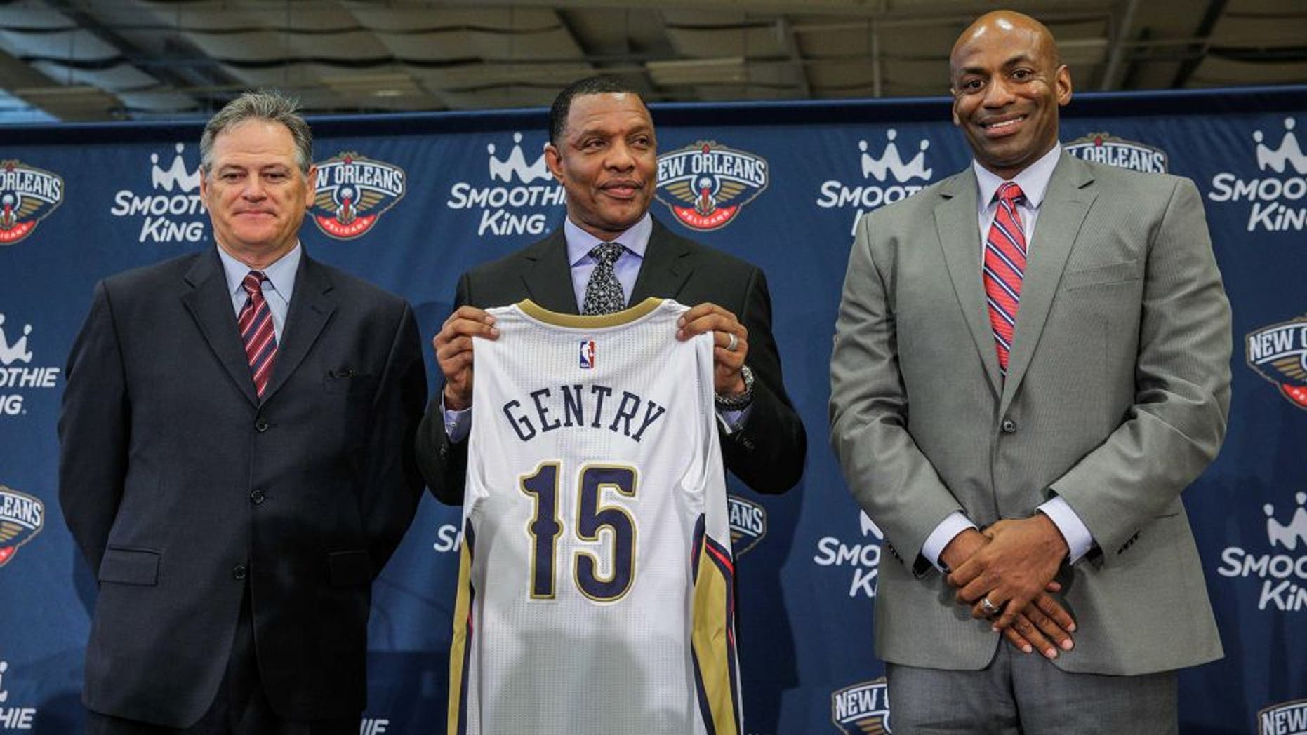 Jun 22, 2015; New Orleans, LA, USA; New Orleans Pelicans head coach Alvin Gentry holds up a jersey with executive vice president Mickey Loomis (left) and general manager Dell Demps (right) during a press conference at the New Orleans Pelicans Training Facility. Mandatory Credit: Derick E. Hingle-USA TODAY Sports
