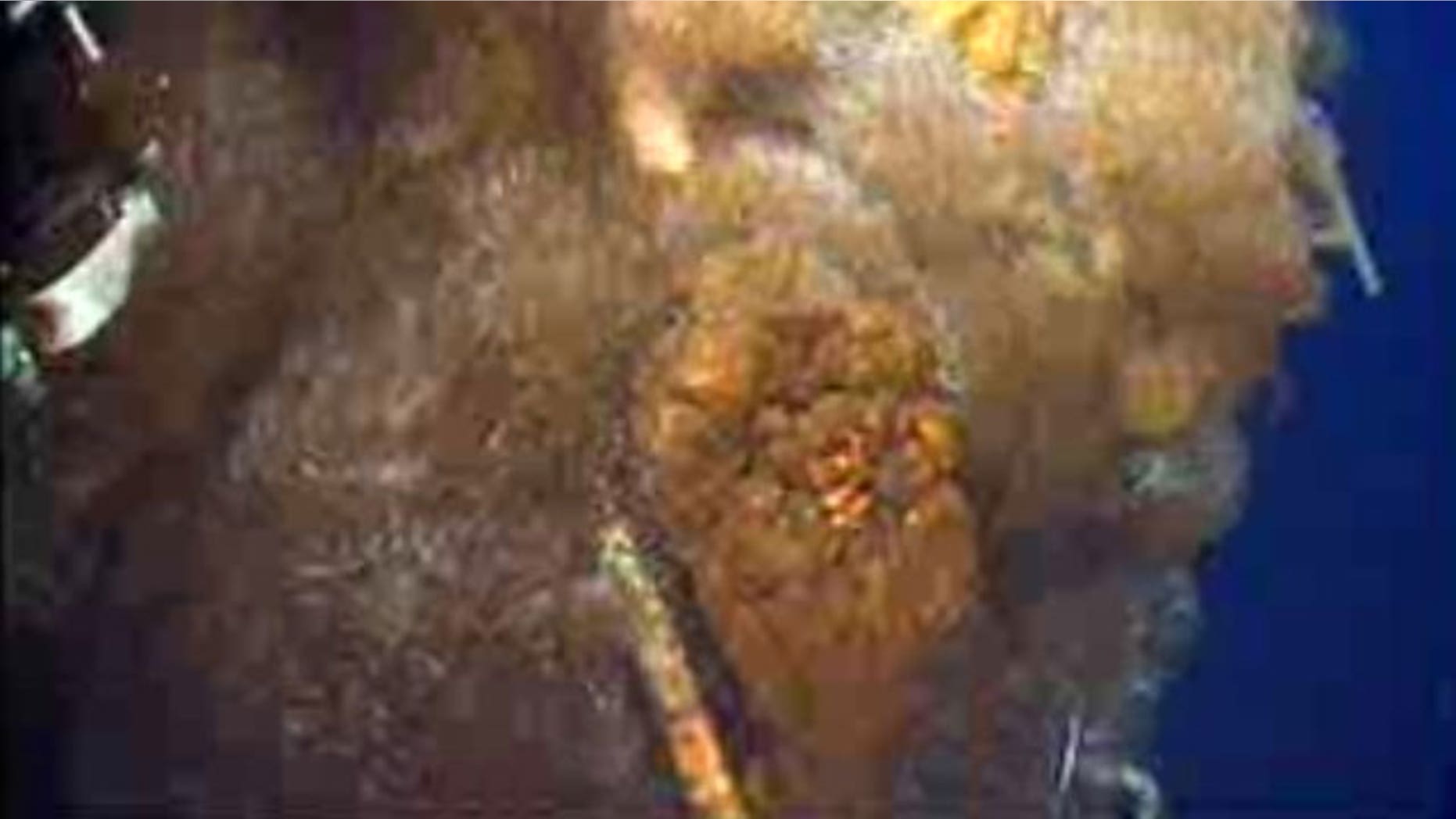 June 23: This image from video provided by BP PLC early Wednesday morning shows oil continuing to gush millions of gallons a day, from the broken wellhead, at the site of the Deepwater Horizon oil well in the Gulf of Mexico.