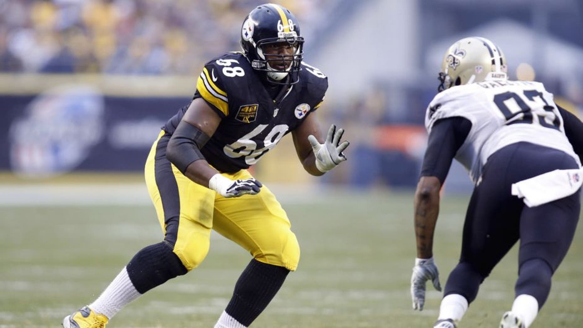 Nov 30, 2014; Pittsburgh, PA, USA; Pittsburgh Steelers tackle Kelvin Beachum (68) blocks at the line of scrimmage against New Orleans Saints outside linebacker Junior Galette (93) during the third quarter at Heinz Field. The Saints won 35-32. Mandatory Credit: Charles LeClaire-USA TODAY Sports