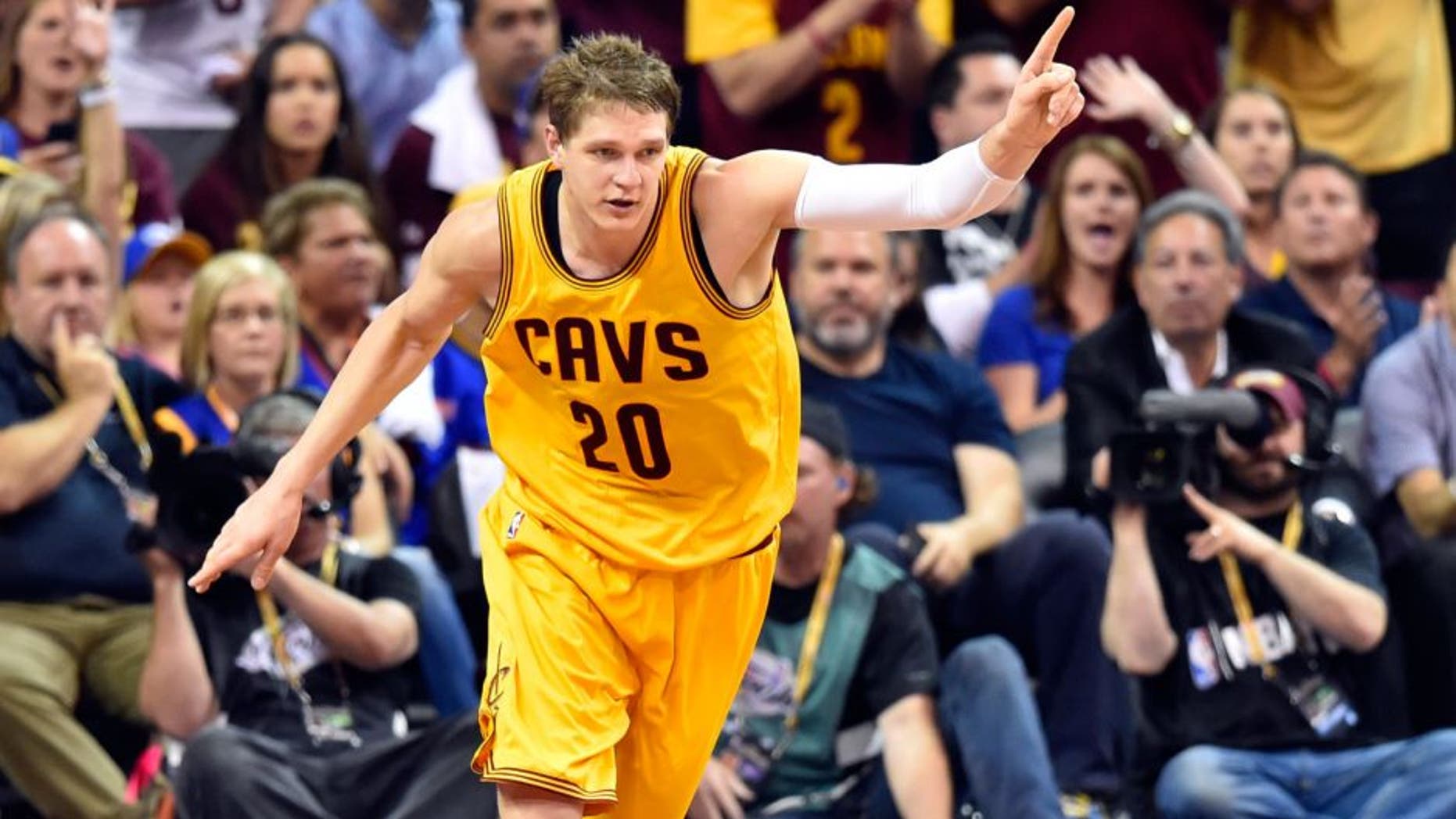 Jun 11, 2015; Cleveland, OH, USA; Cleveland Cavaliers center Timofey Mozgov (20) reacts during the third quarter of game four of the NBA Finals against the Golden State Warriors at Quicken Loans Arena.